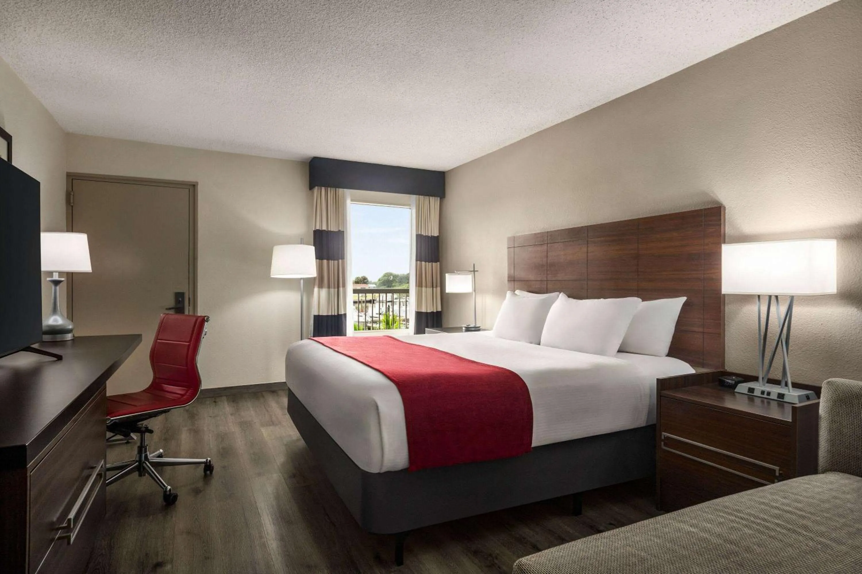 Photo of the whole room, Bed in Ramada by Wyndham Sarasota Waterfront