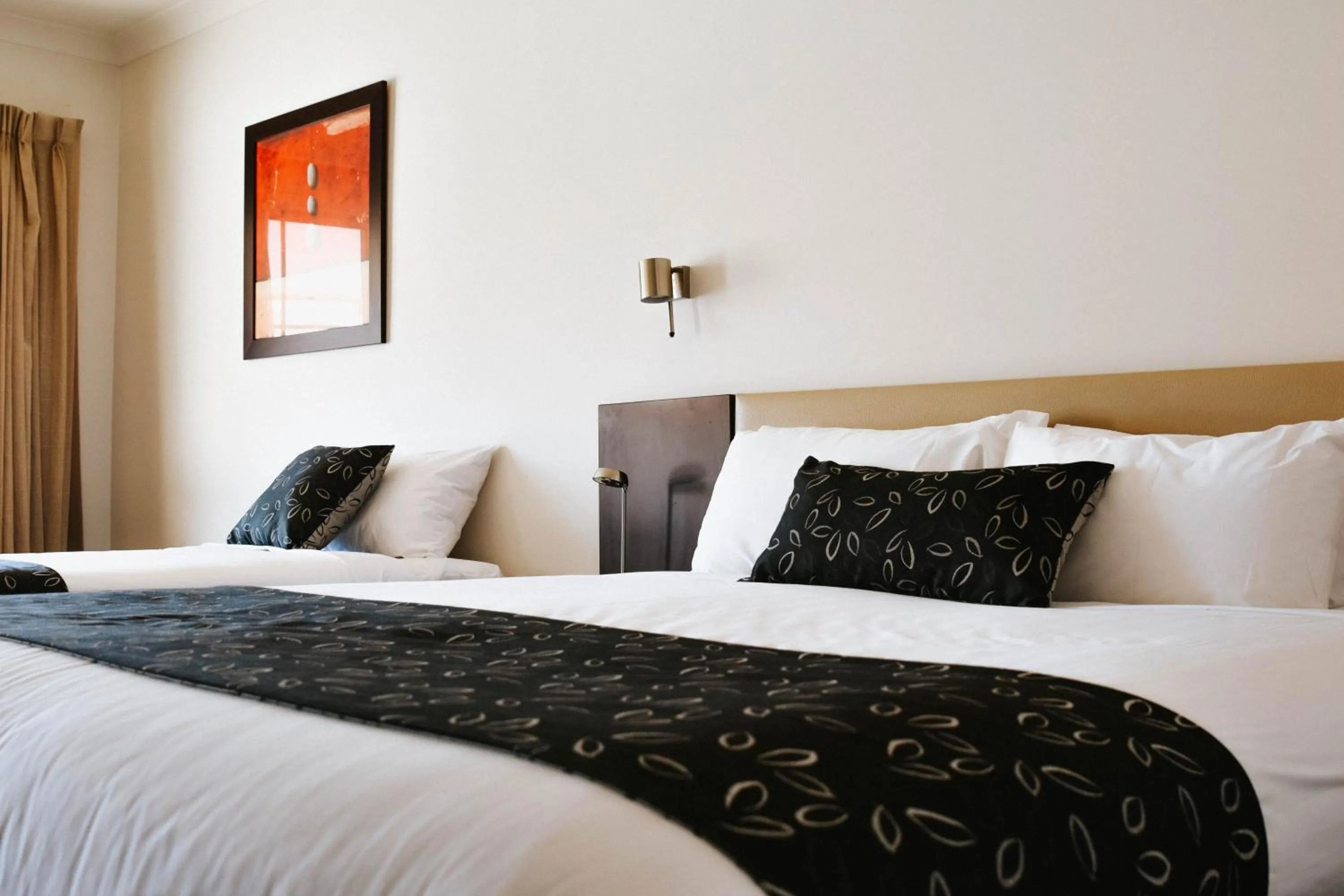 Bed in Charles Sturt Suites & Apartments