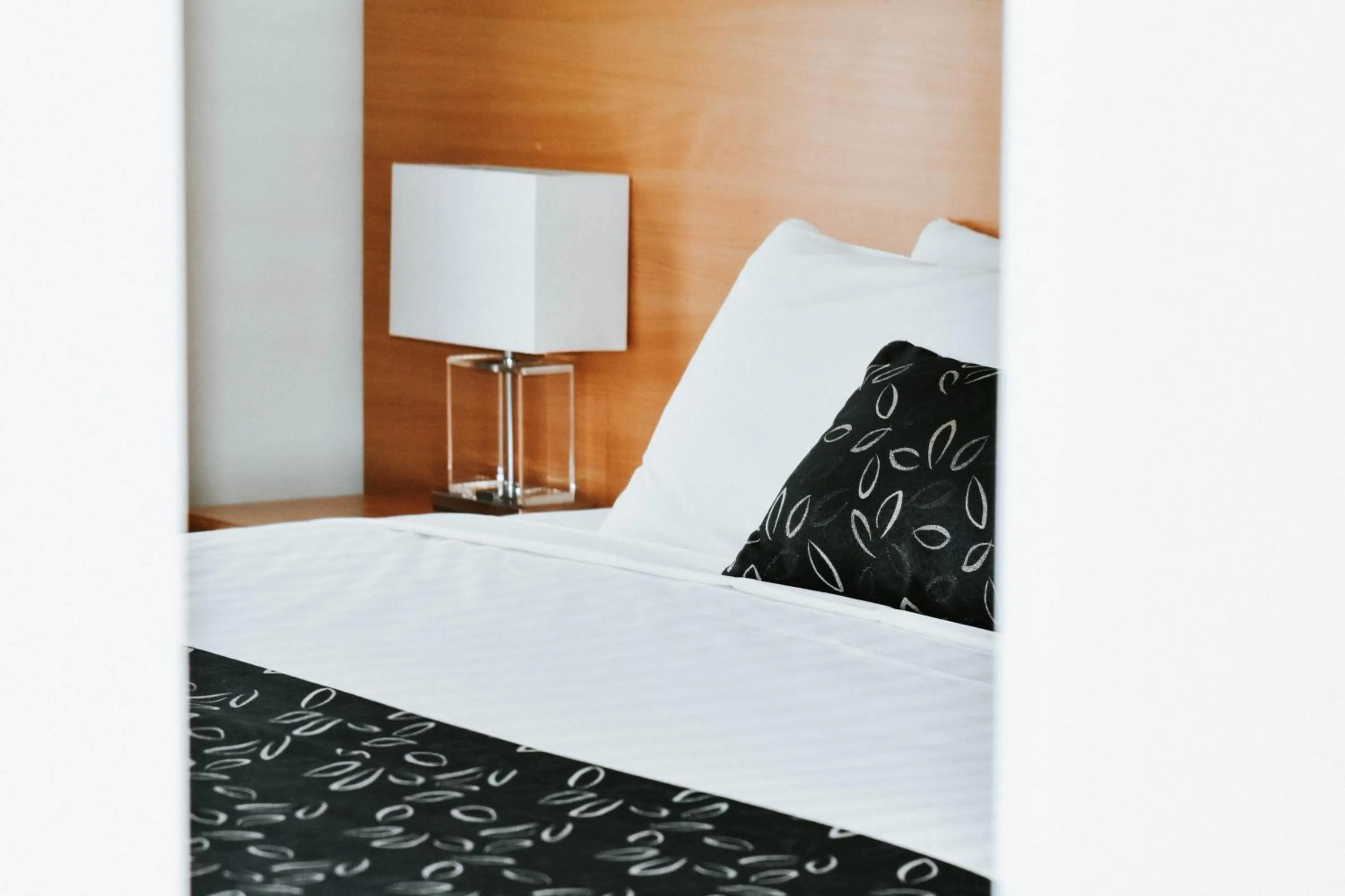 Bed in Charles Sturt Suites & Apartments
