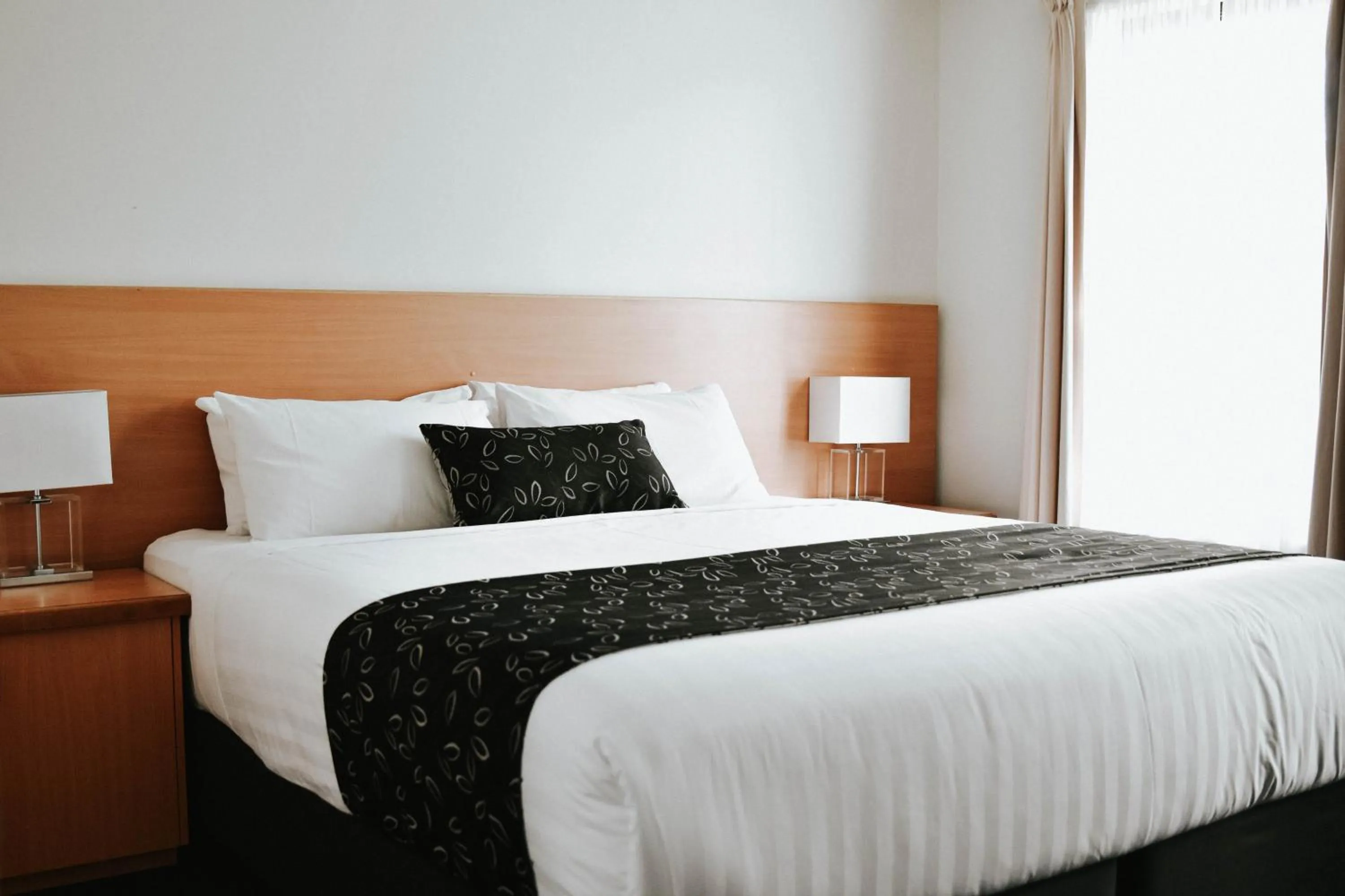 Bed in Charles Sturt Suites & Apartments