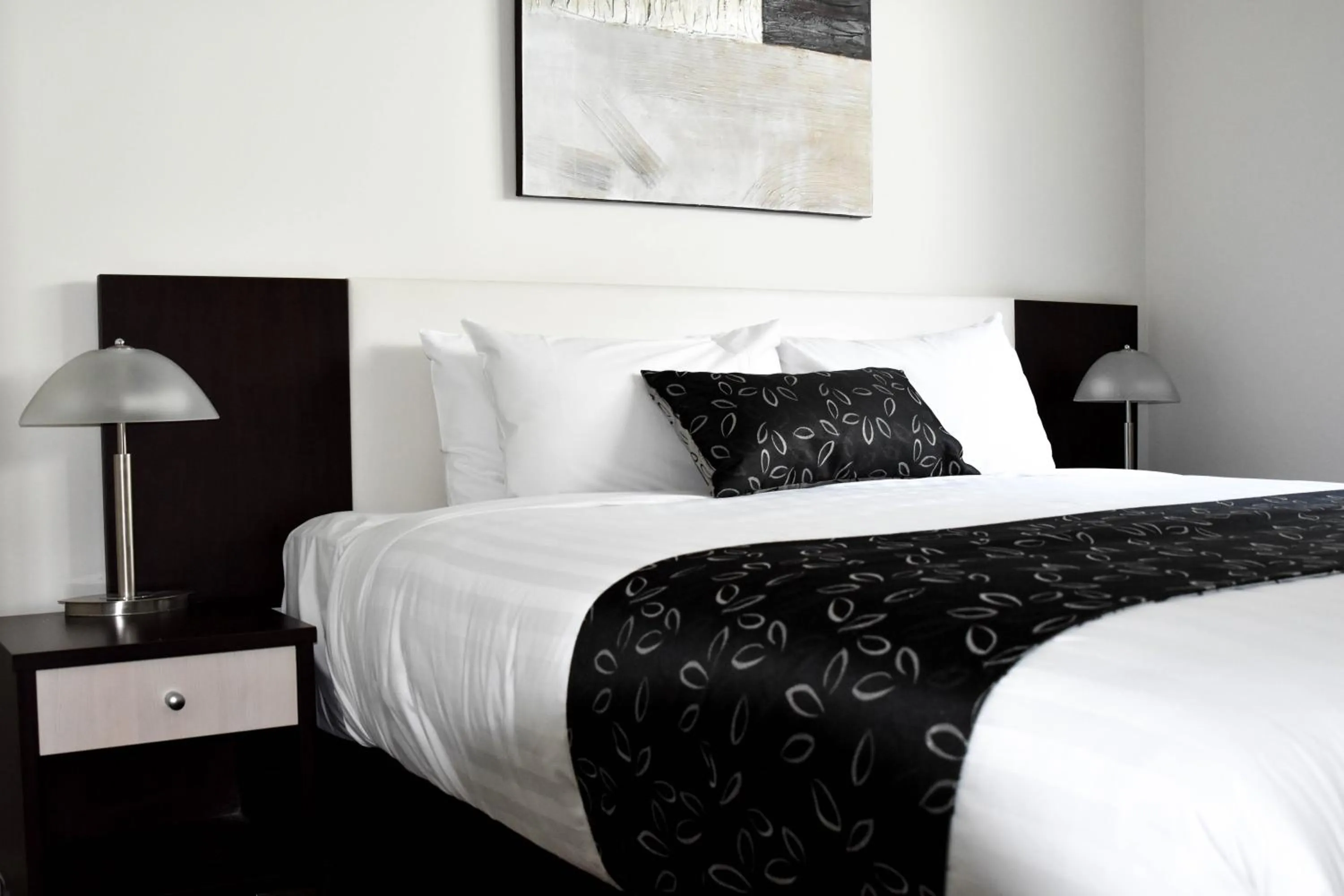 Bed in Charles Sturt Suites & Apartments