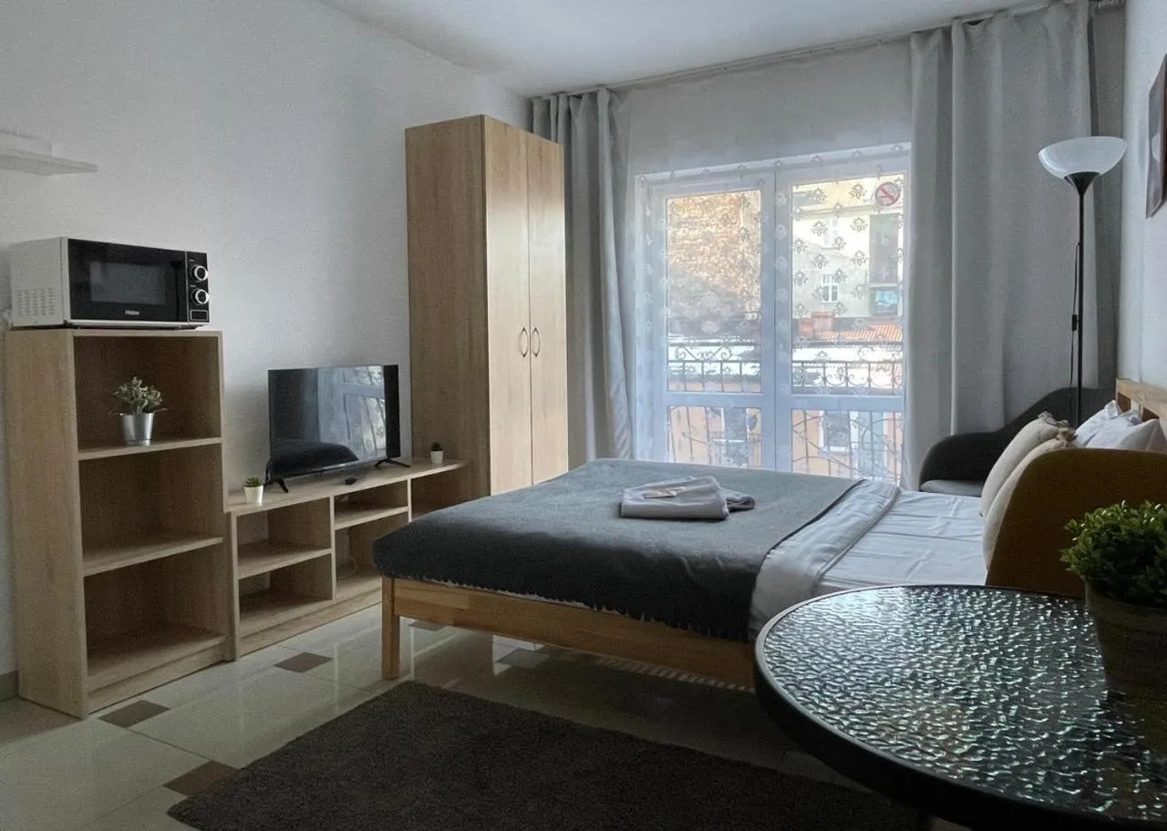 Communal lounge/ TV room, Bed in Bubble Hostel