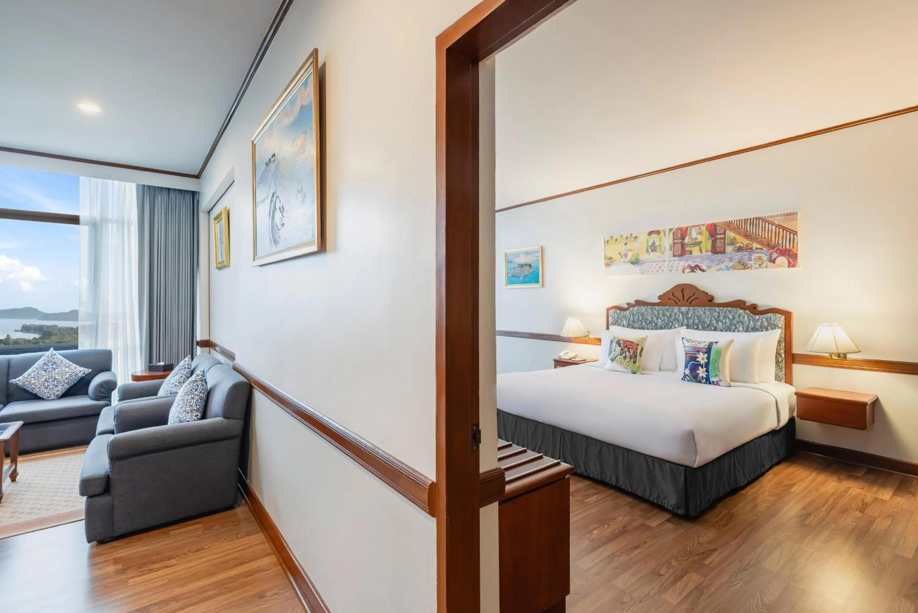 Living room, Bed in Royal Phuket City Hotel