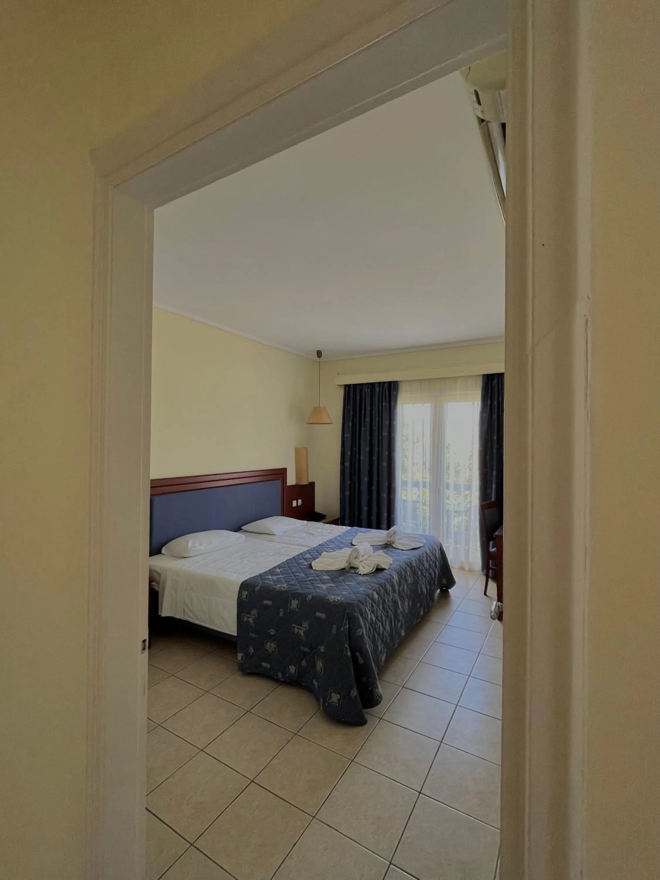 Bed in Theodorou Beach Hotel Apartments