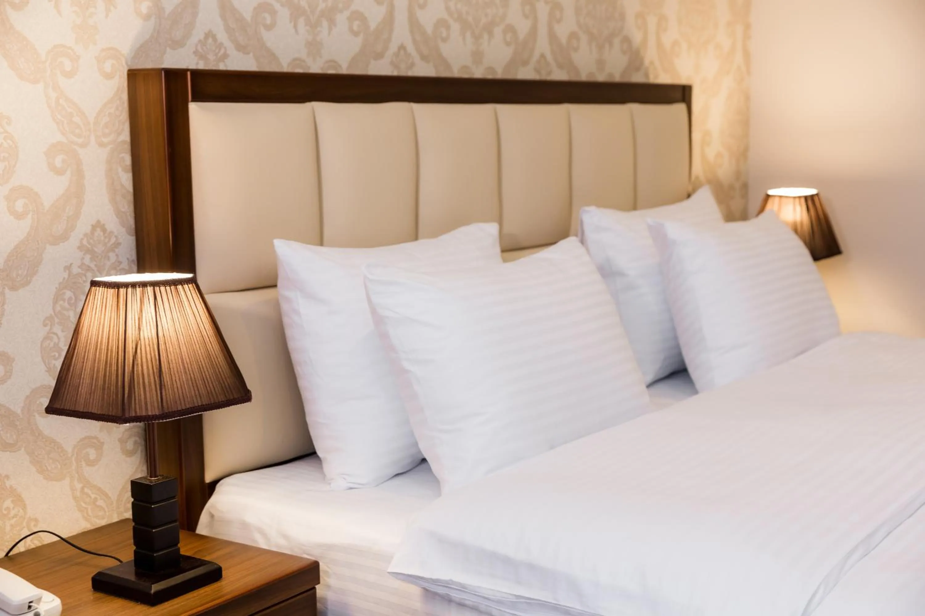 Bed in Orchid Boutique Hotel