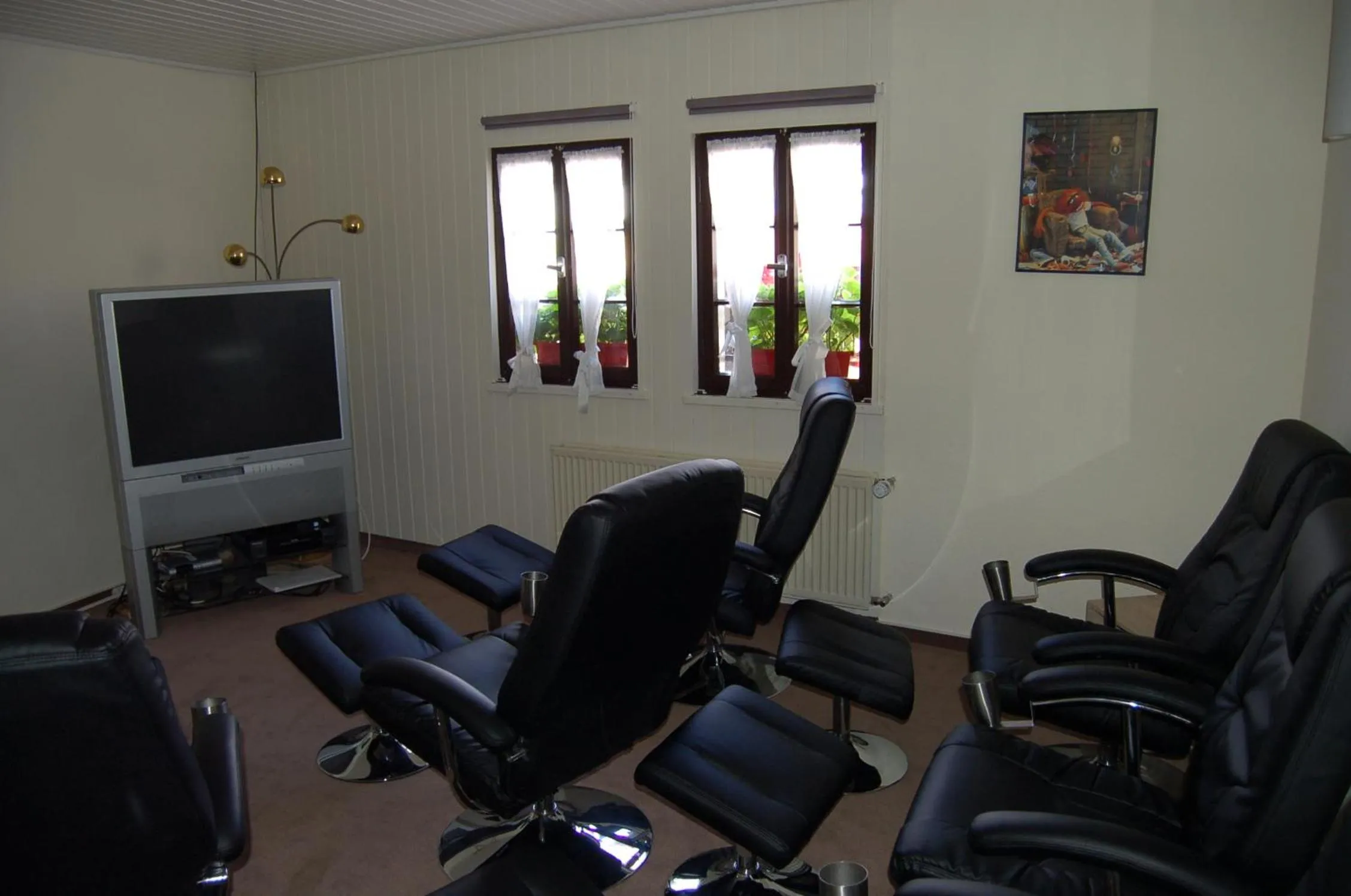 Communal lounge/ TV room in Landgasthaus Pfahl