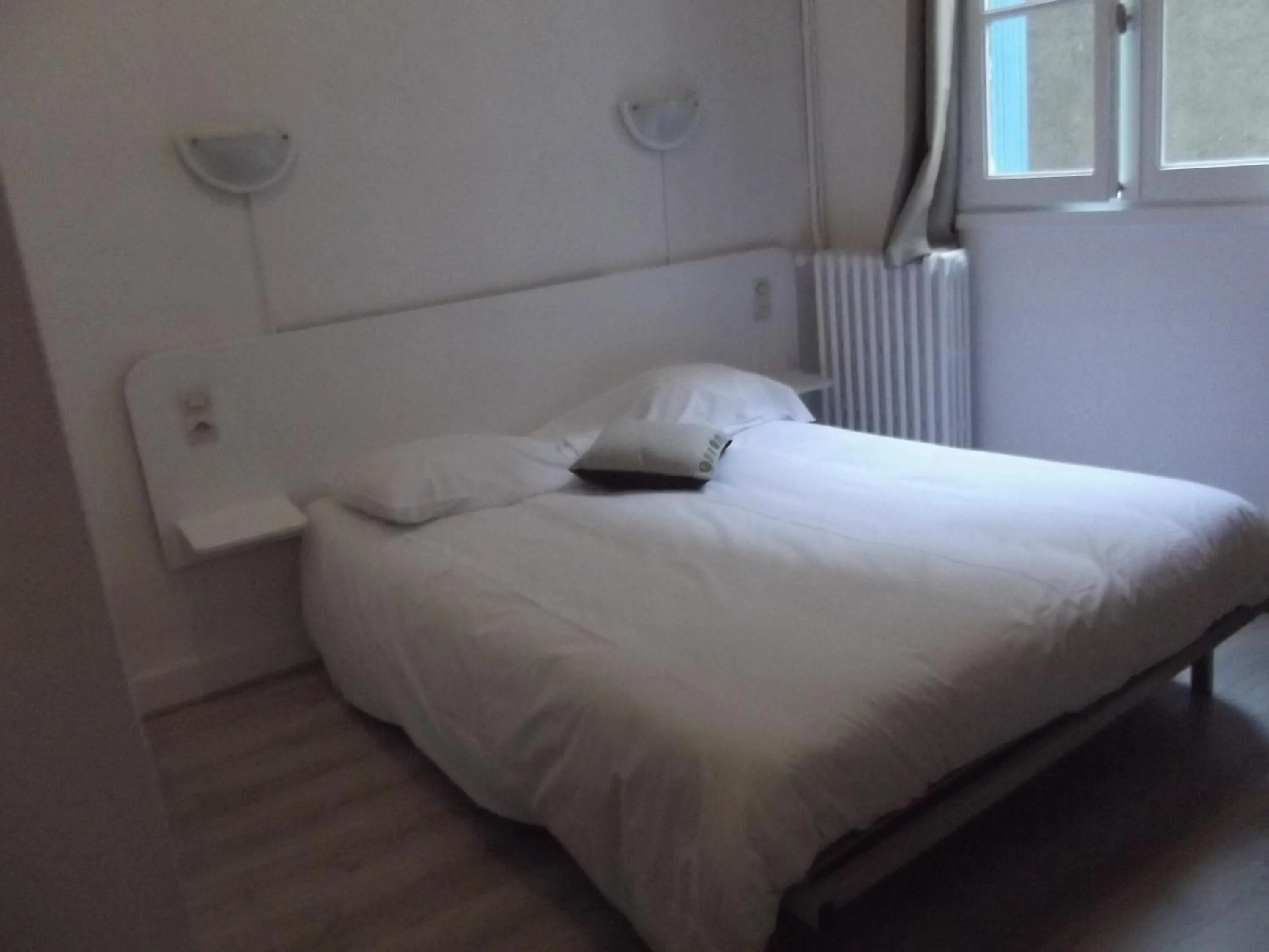 Bed in Hotel De La Poste