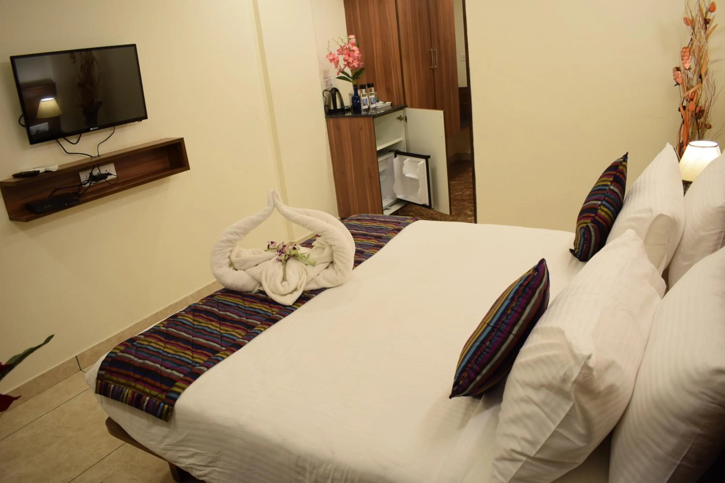 Bed in Silicon Inn Hotel Bangalore Airport
