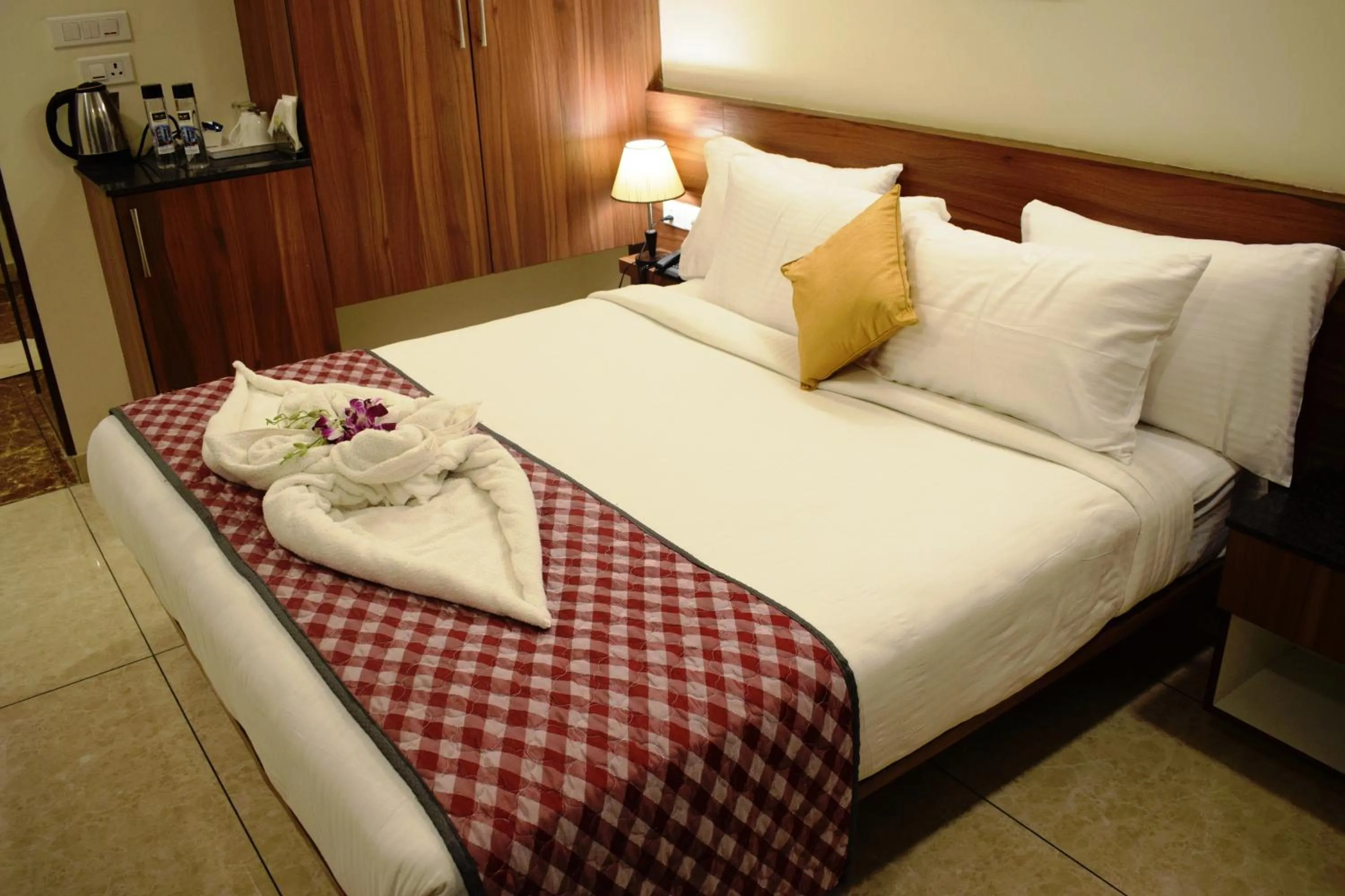 Bed in Silicon Inn Hotel Bangalore Airport