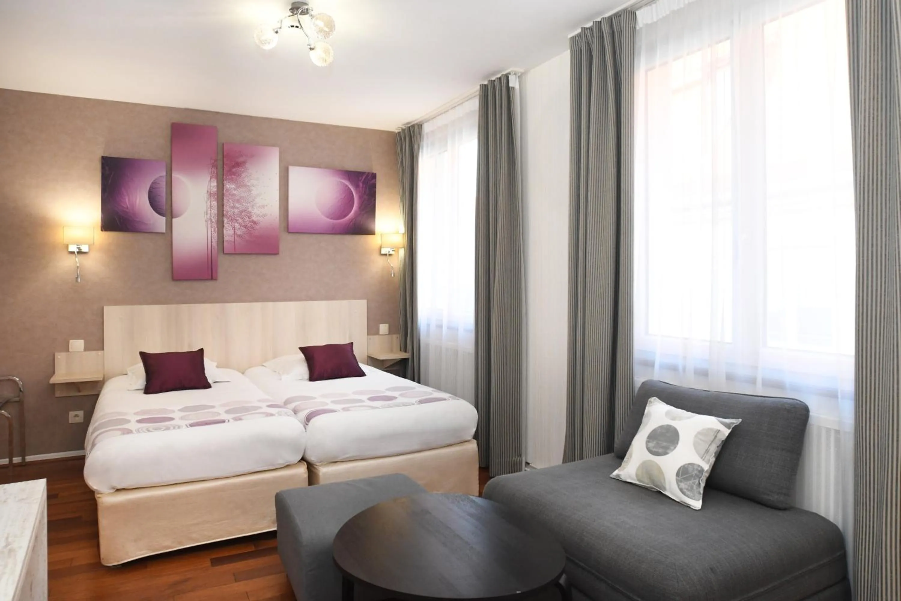 Photo of the whole room, Bed in Logis Hôtel du Centre - Halte idéale en cyclotourisme avec garage à vélos clos