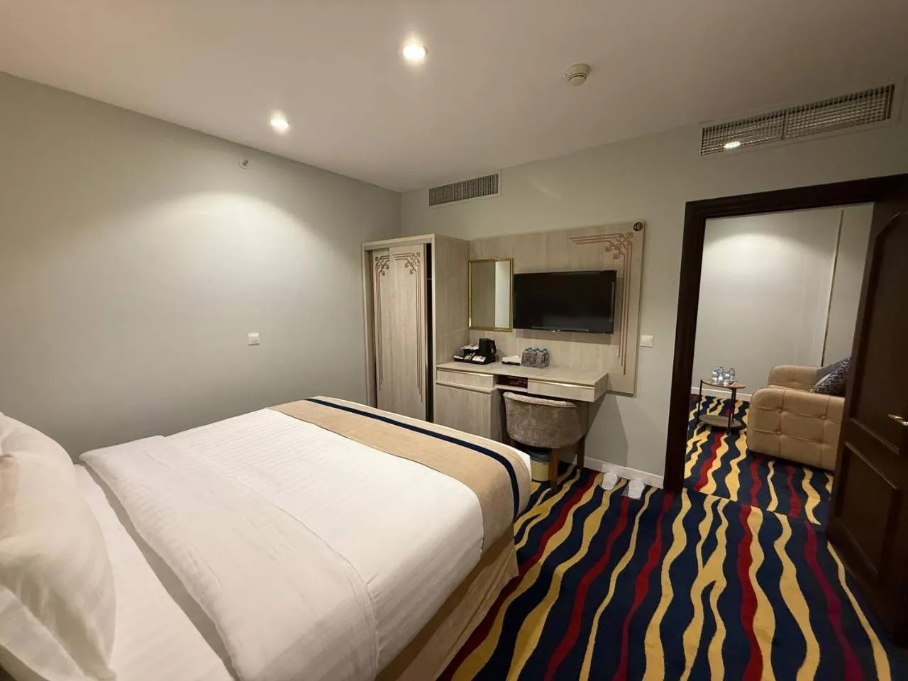 Communal lounge/ TV room in Dar Al Naem Hotel