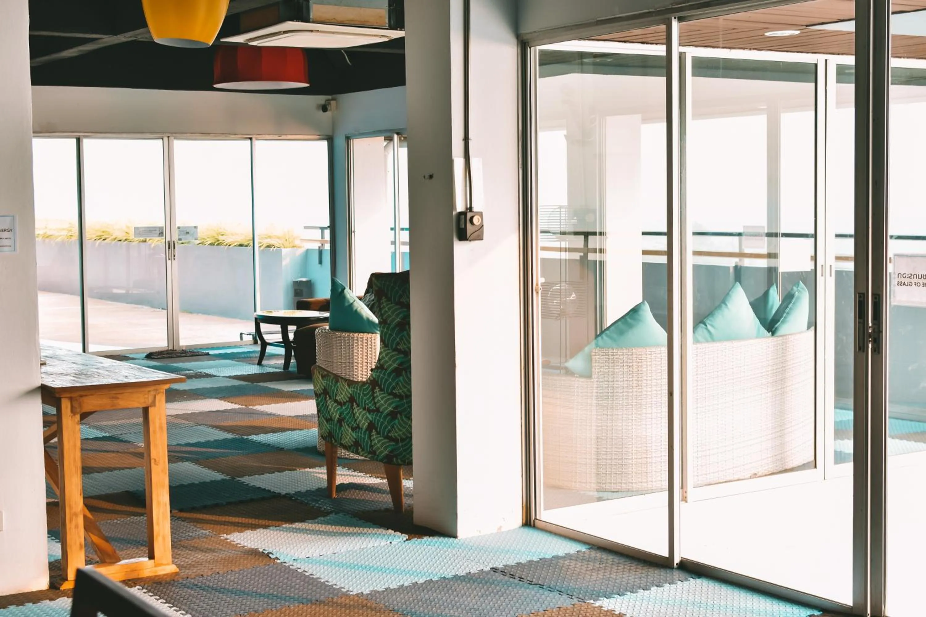 Communal lounge/ TV room in THALAY Cha-am by THA