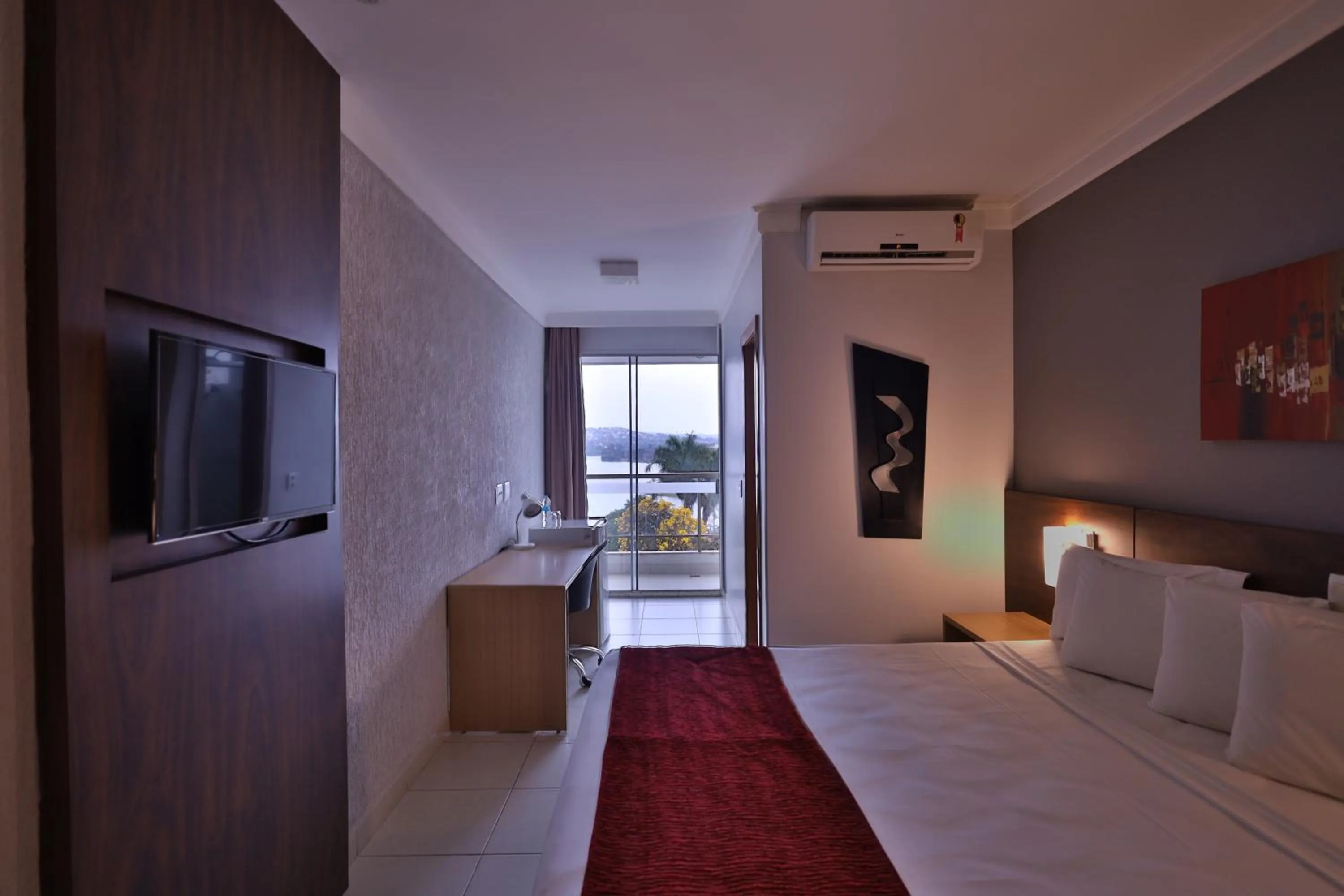 Bed in Ramada Hotel & Suites Lagoa Santa By Wyndham