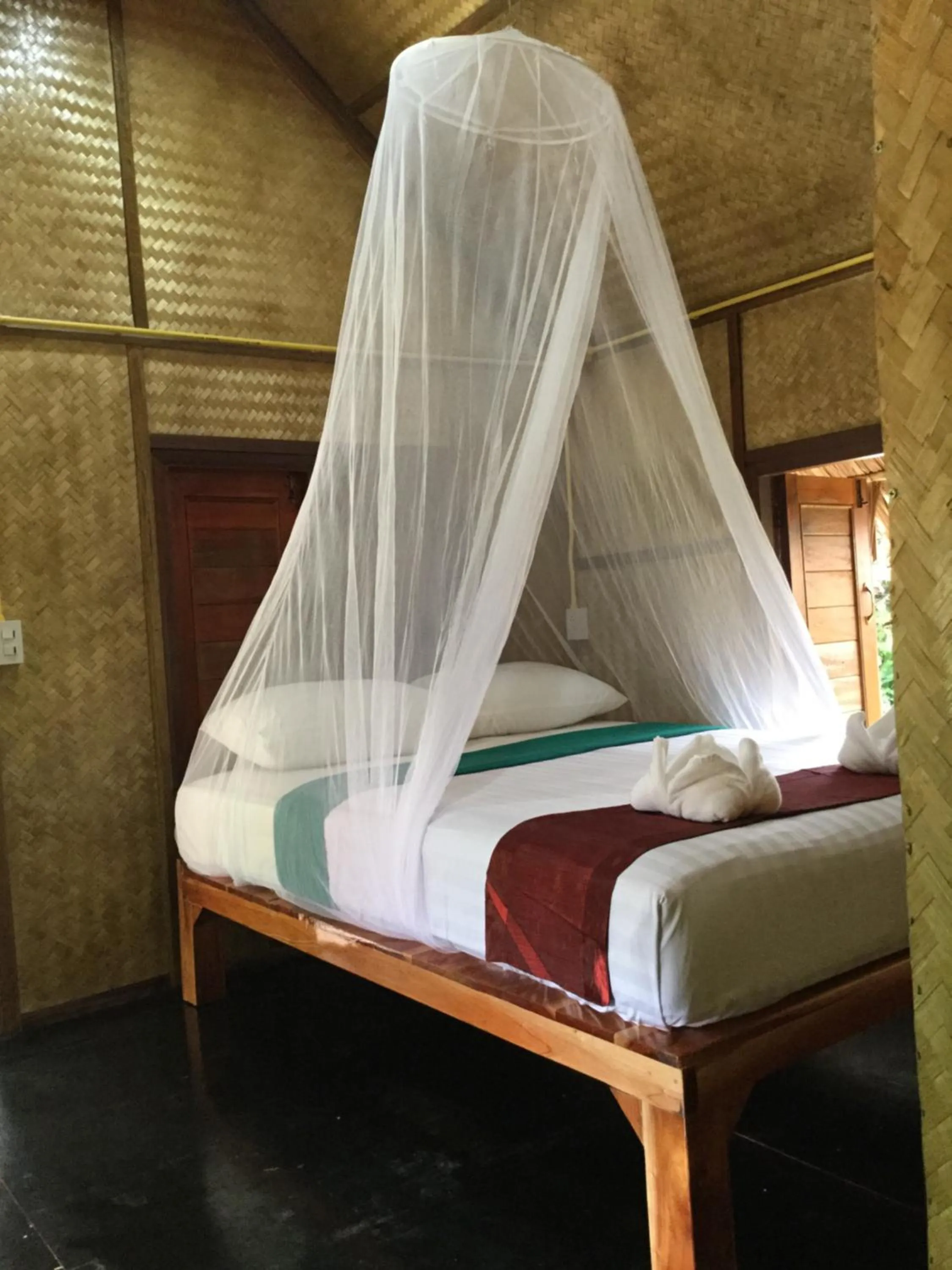 Photo of the whole room, Bed in Khaosok Bamboo Huts Resort