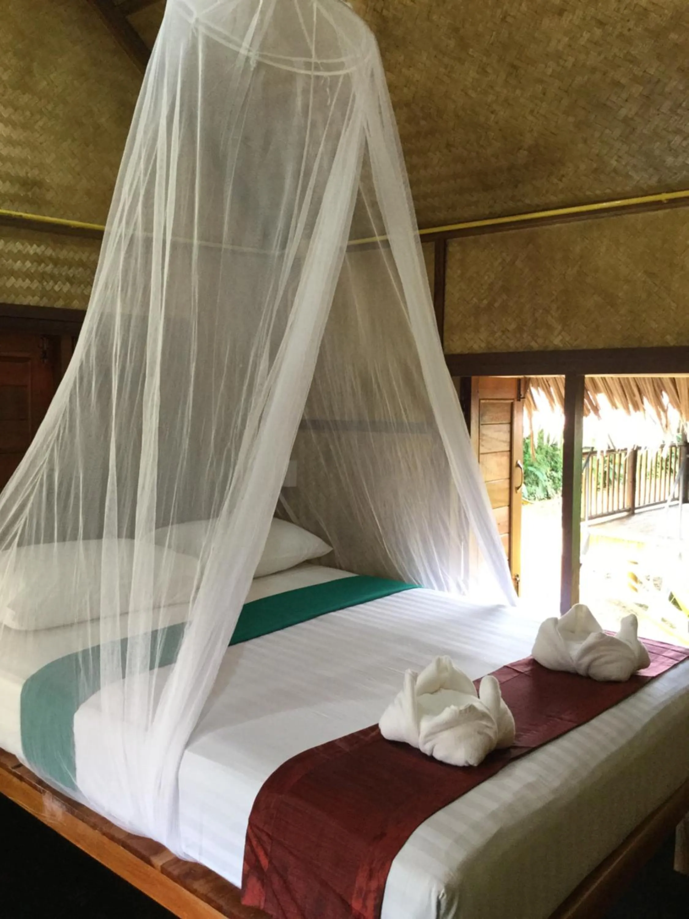 Bed in Khaosok Bamboo Huts Resort