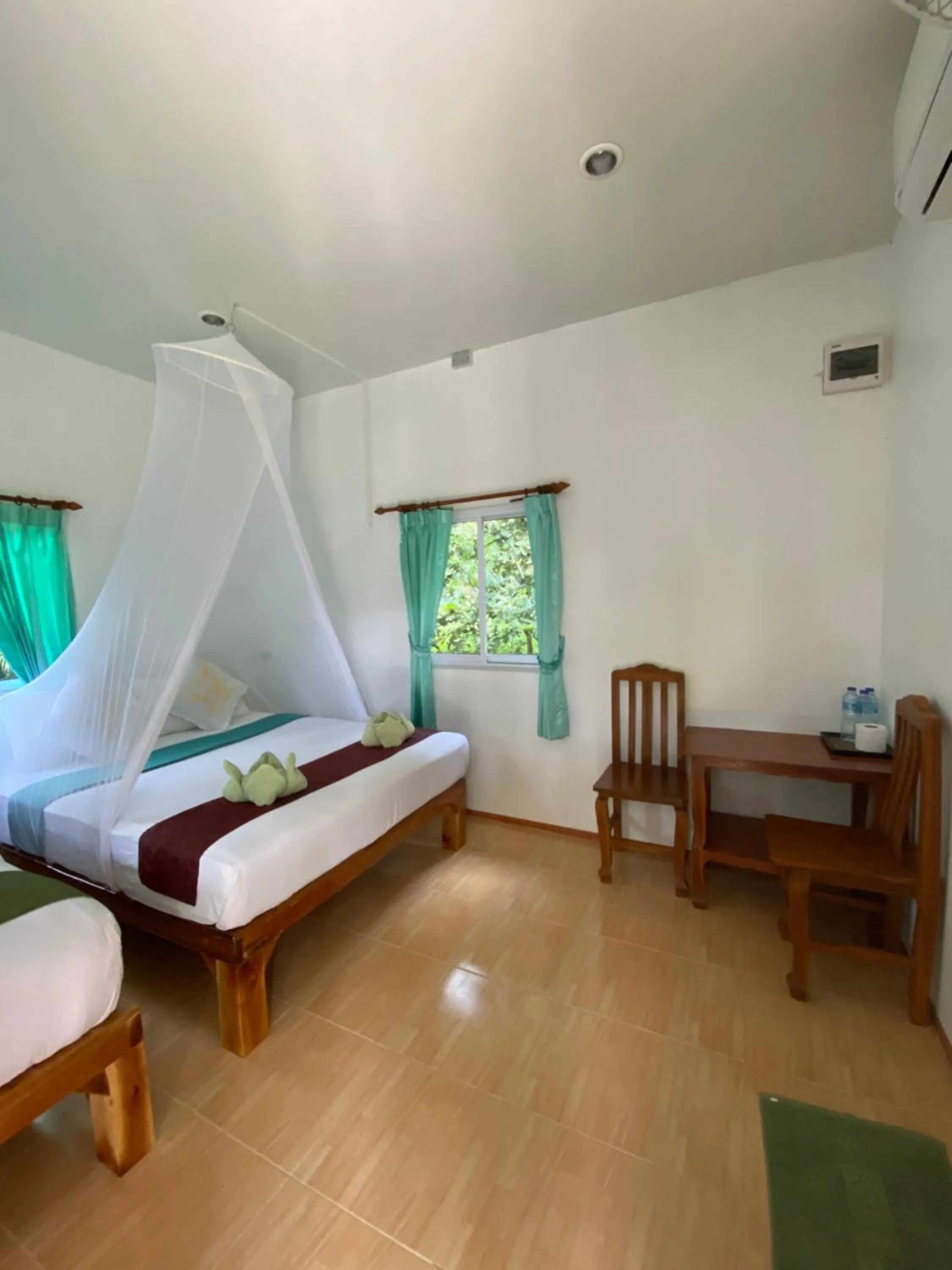 Photo of the whole room, Bed in Khaosok Bamboo Huts Resort