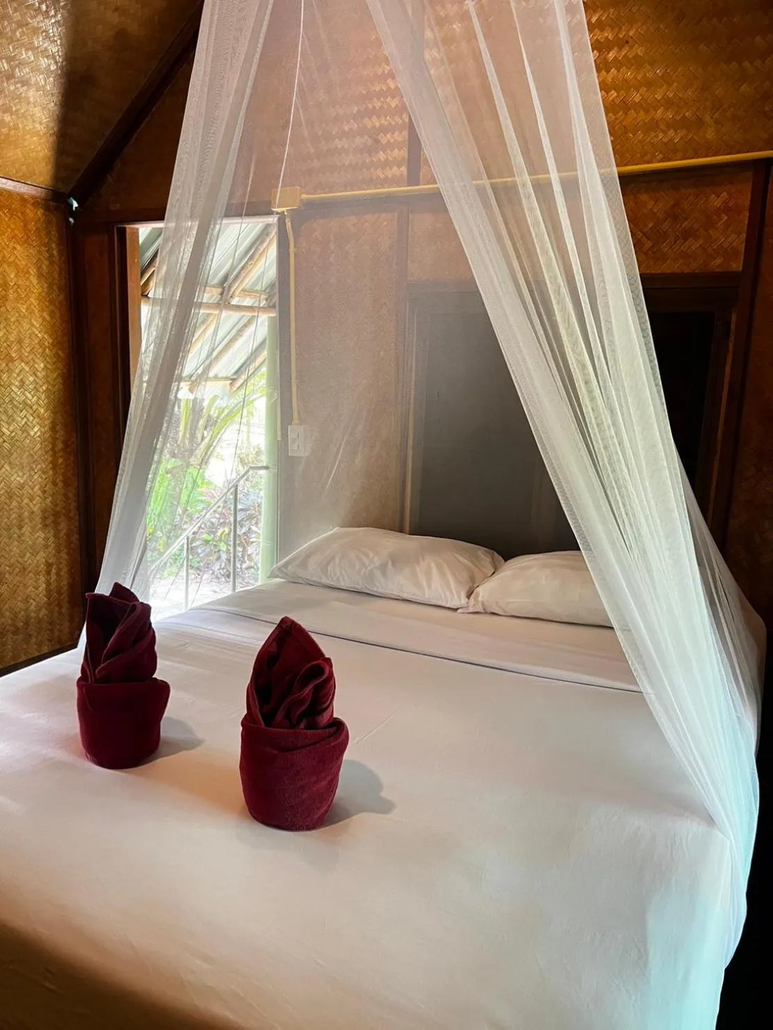 Bed in Khaosok Bamboo Huts Resort