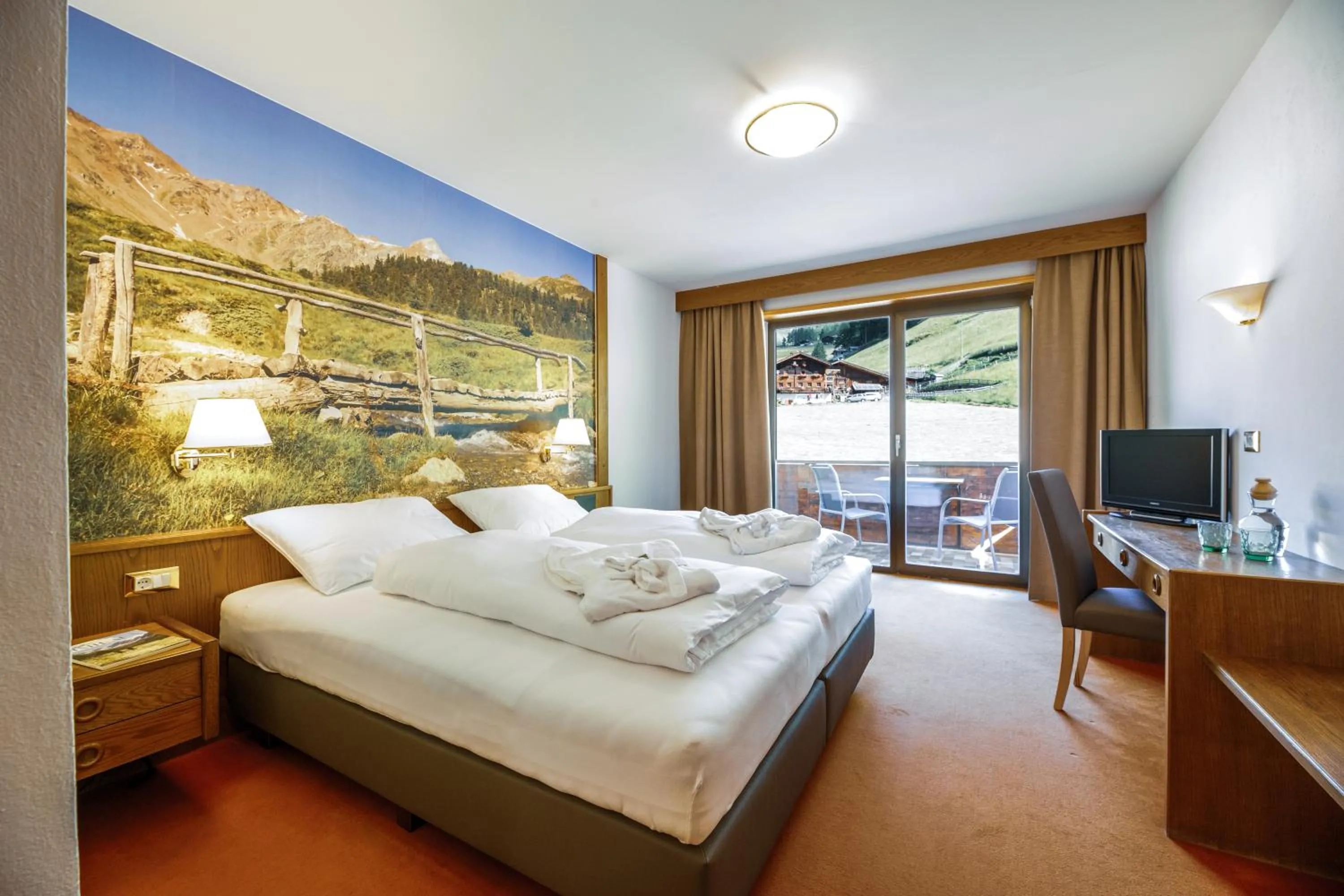 Photo of the whole room, Bed in Berghotel Tyrol