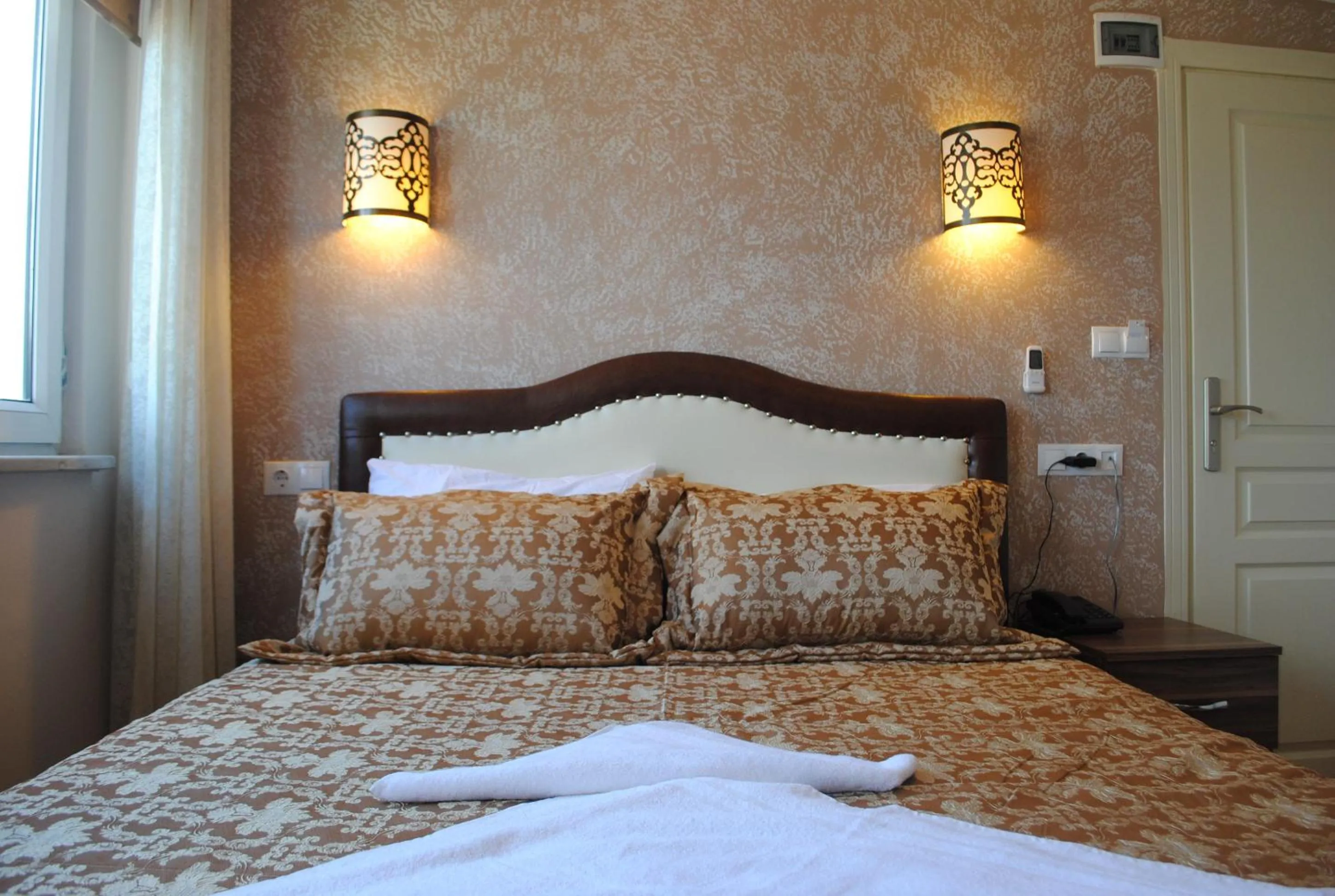 Bed in Hotel Buhara Family Inn