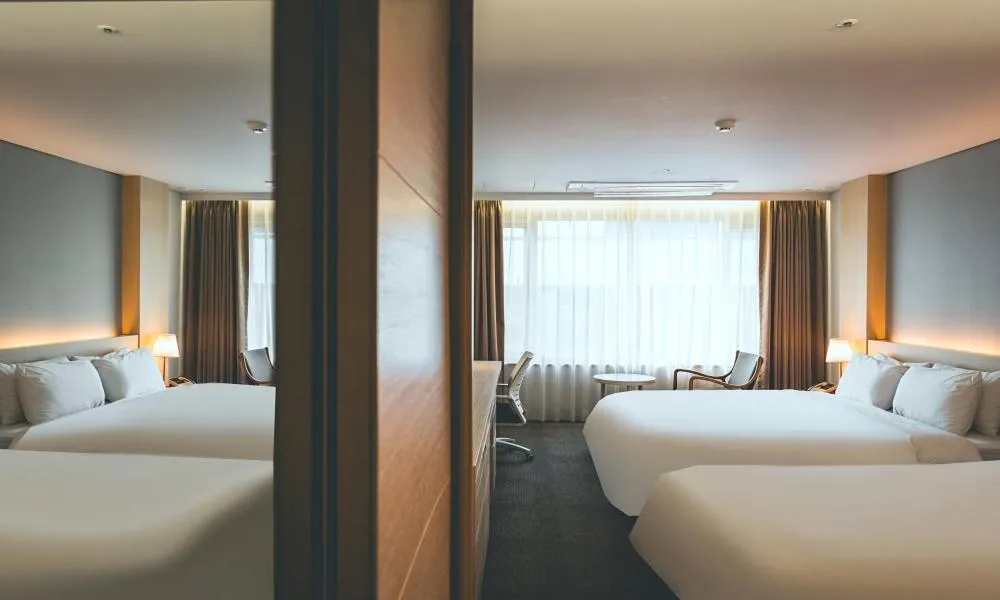 Bed in Wonju City Hotel HYEOKSIN