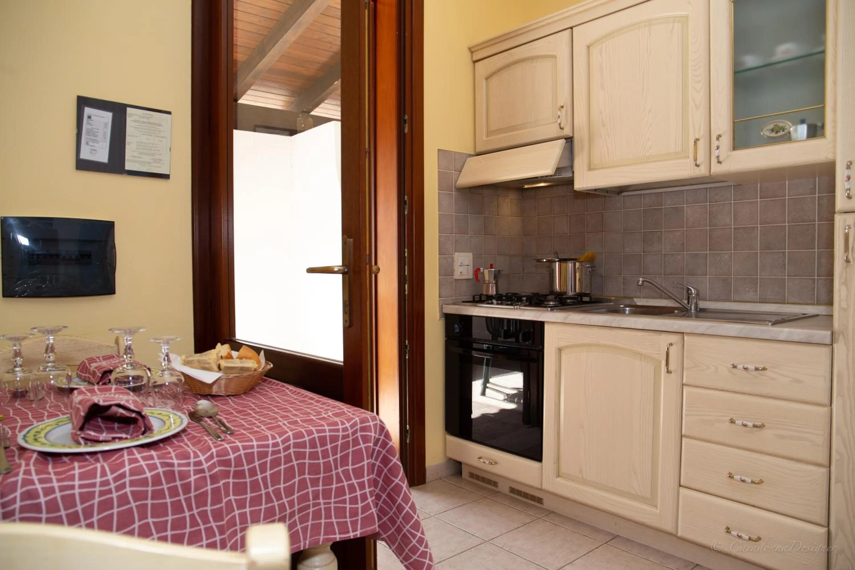 Kitchen or kitchenette in Camping Village La Pineta