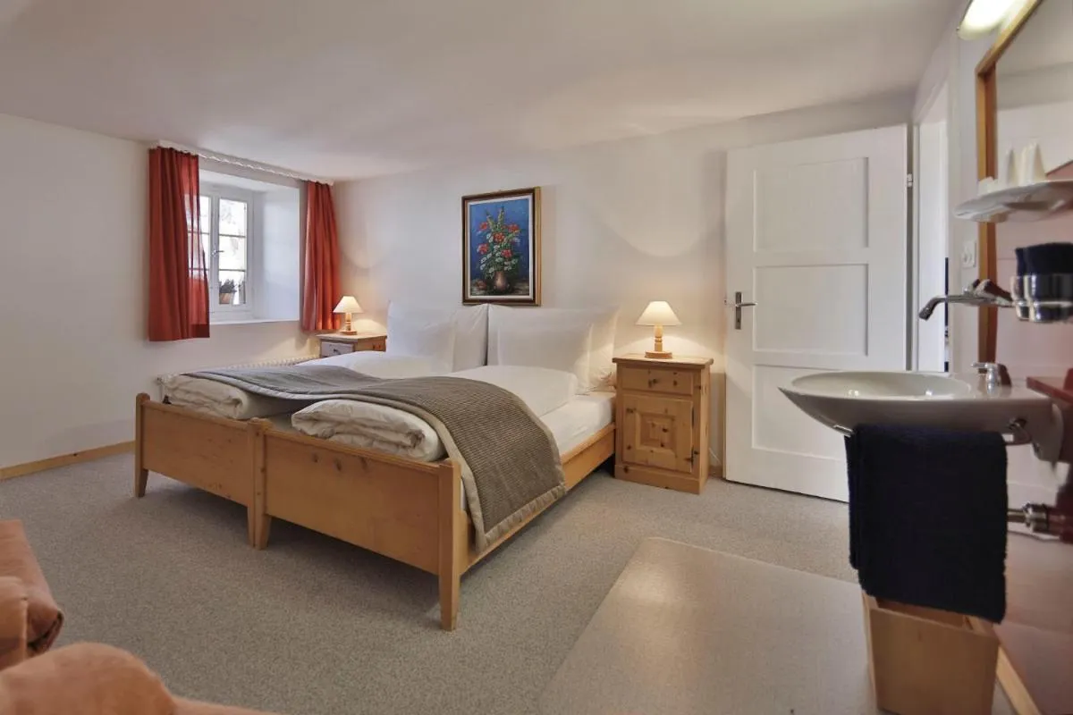 Photo of the whole room, Bed in Relais & Châteaux IN LAIN Hotel Cadonau