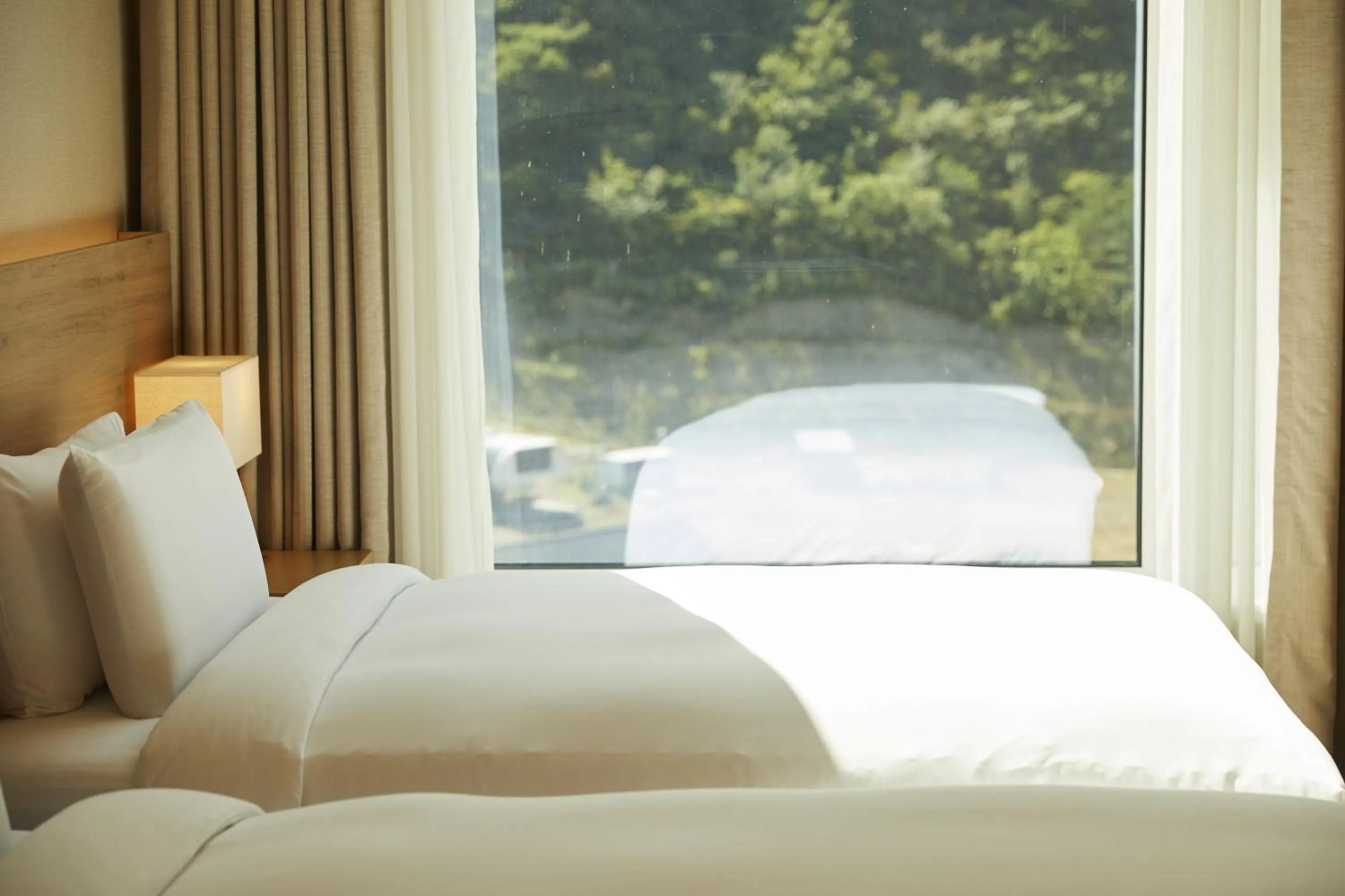 Bed in PARK ROCHE Resort & Wellness