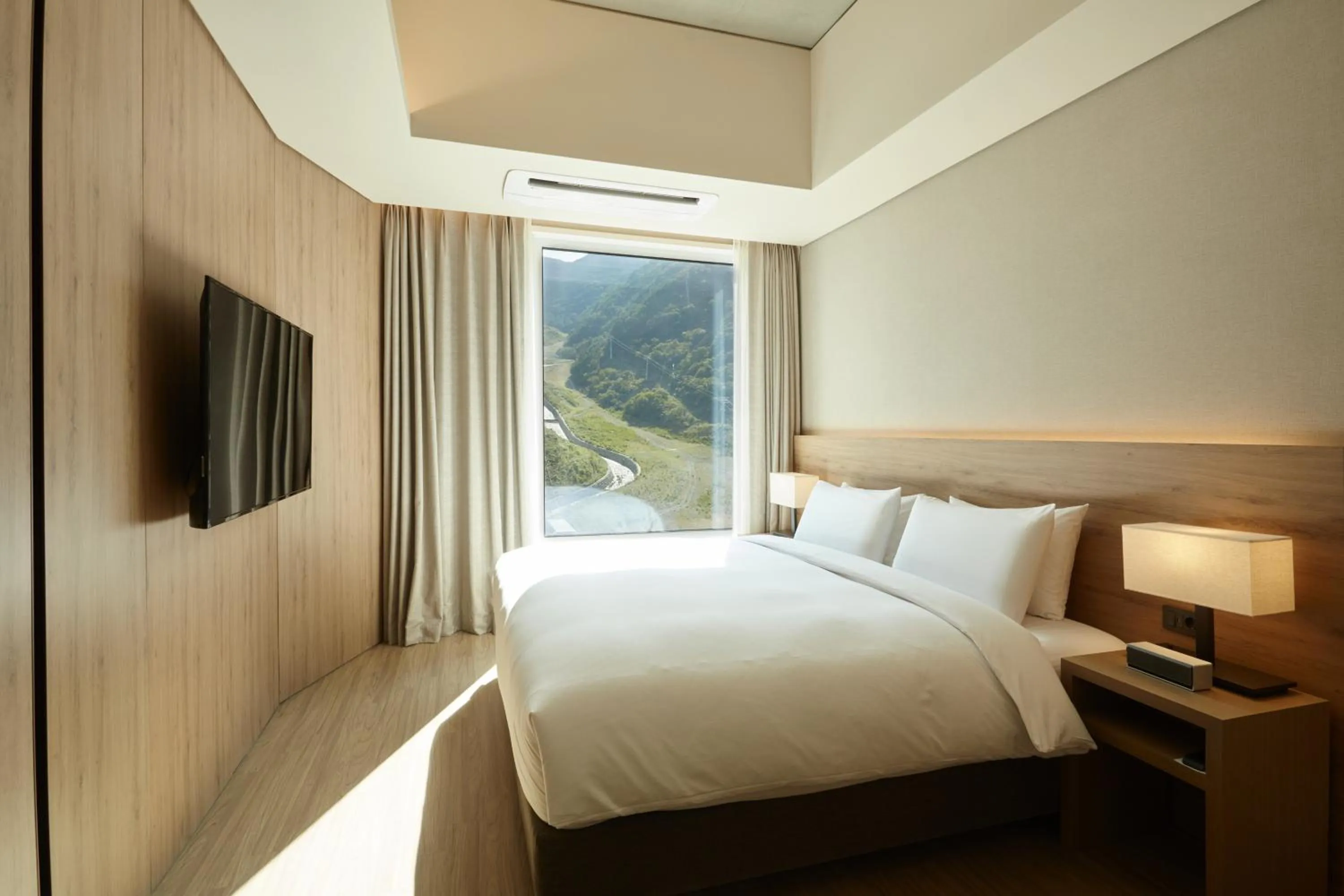 Bed in PARK ROCHE Resort & Wellness