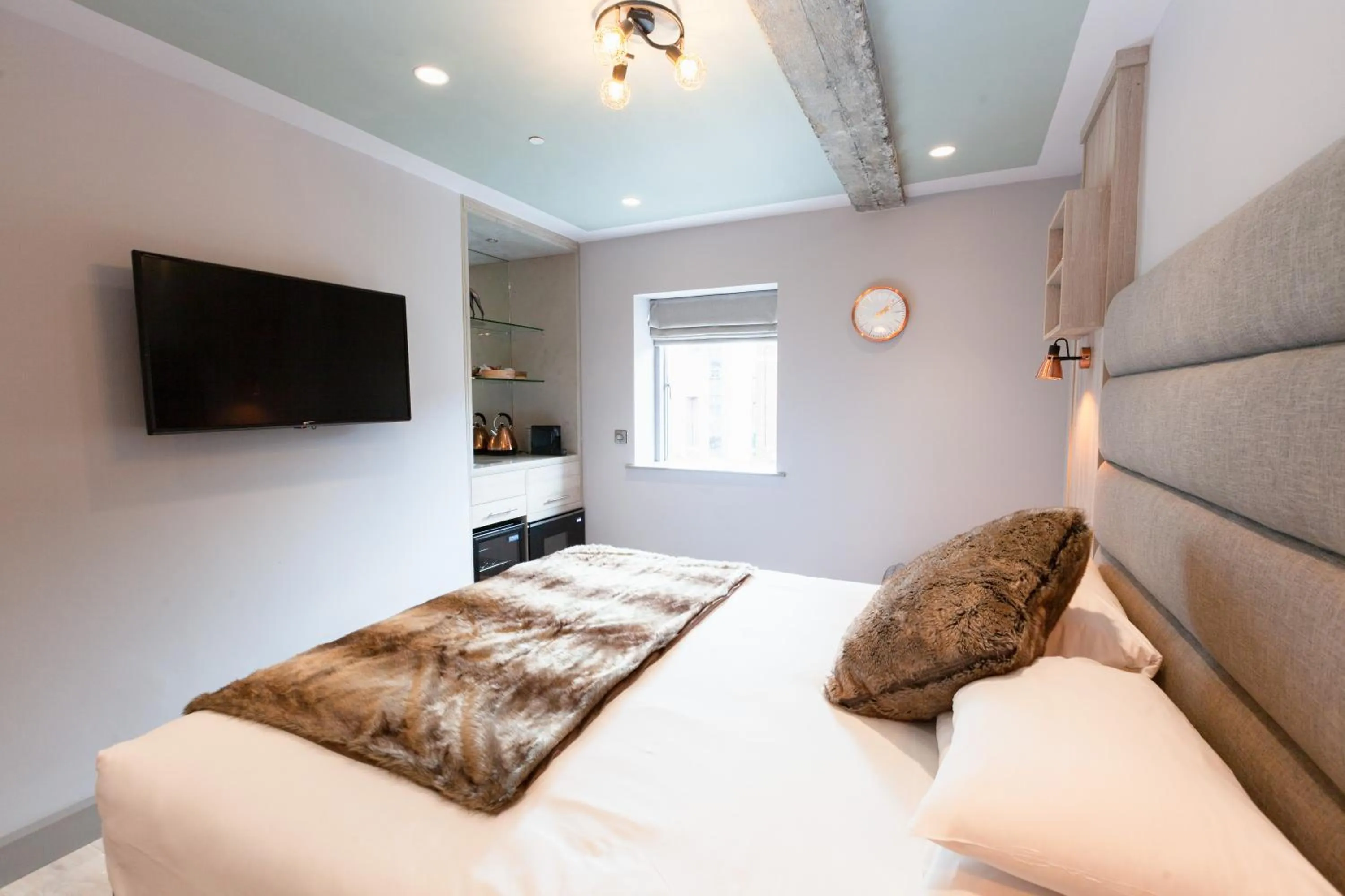 Bed in Clarendon Suites