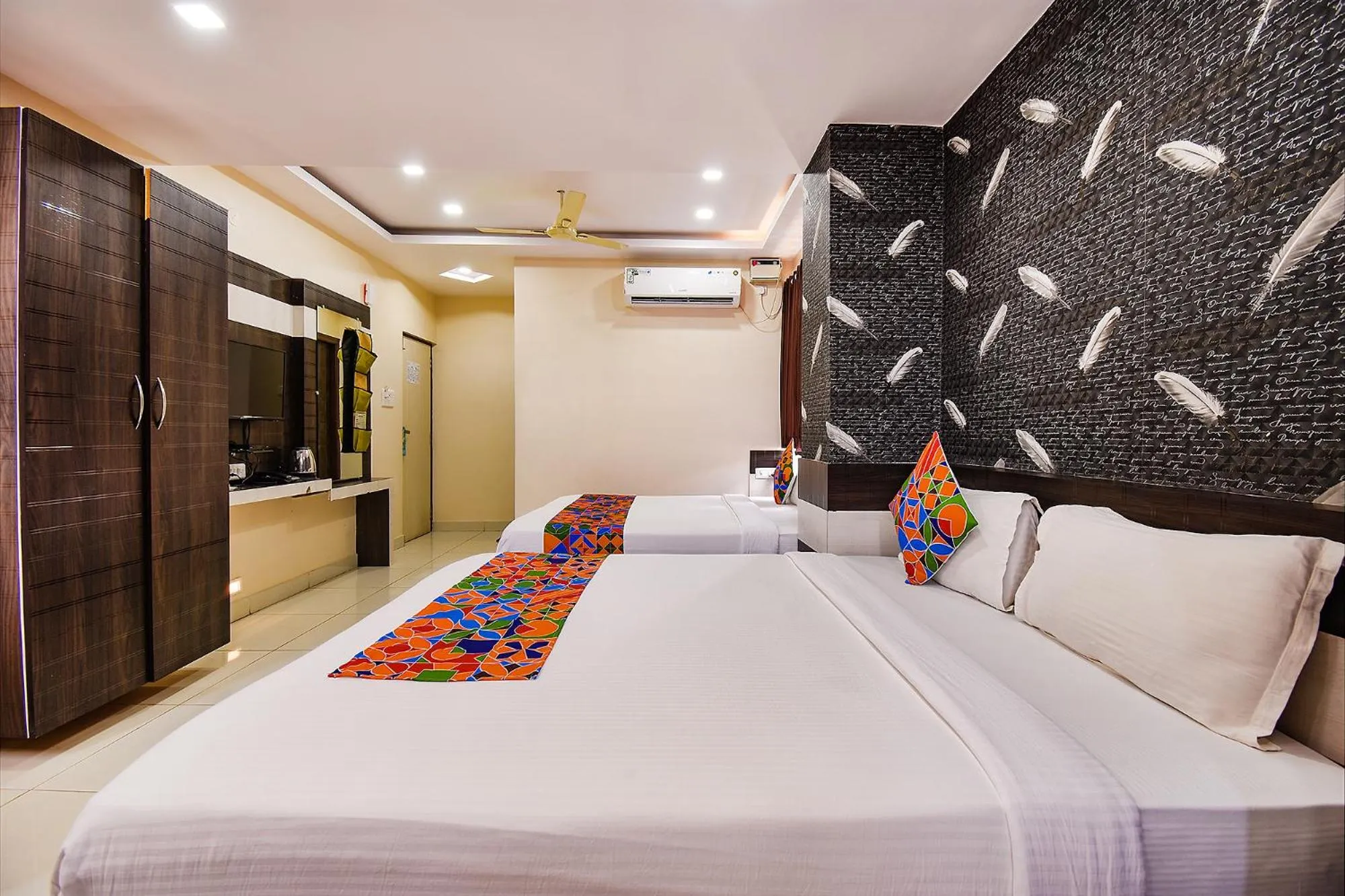 Bed in FabHotel Rotano Suites - Yelahanka