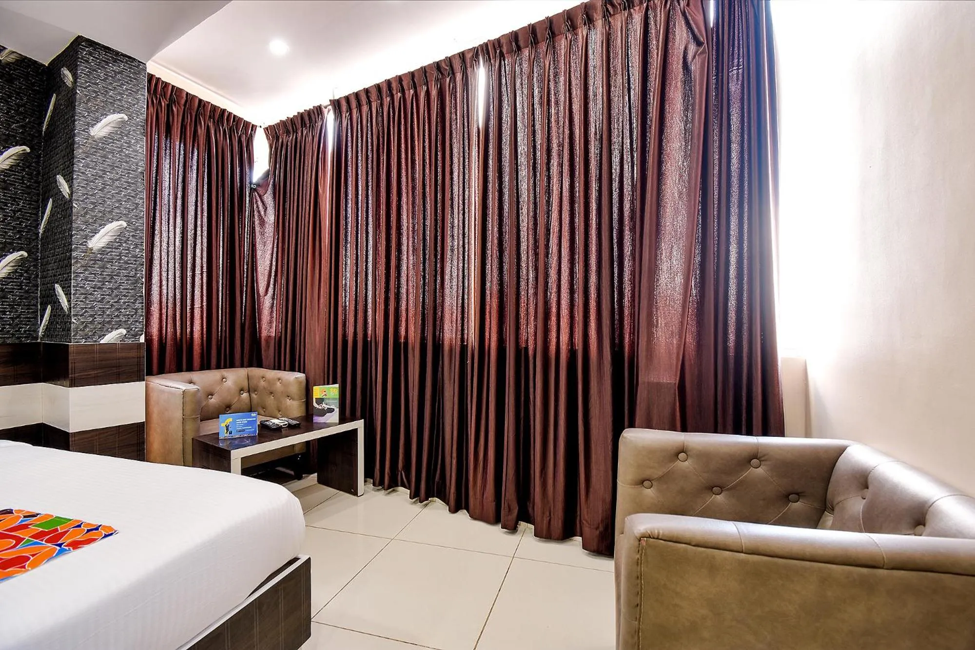 Bed in FabHotel Rotano Suites - Yelahanka