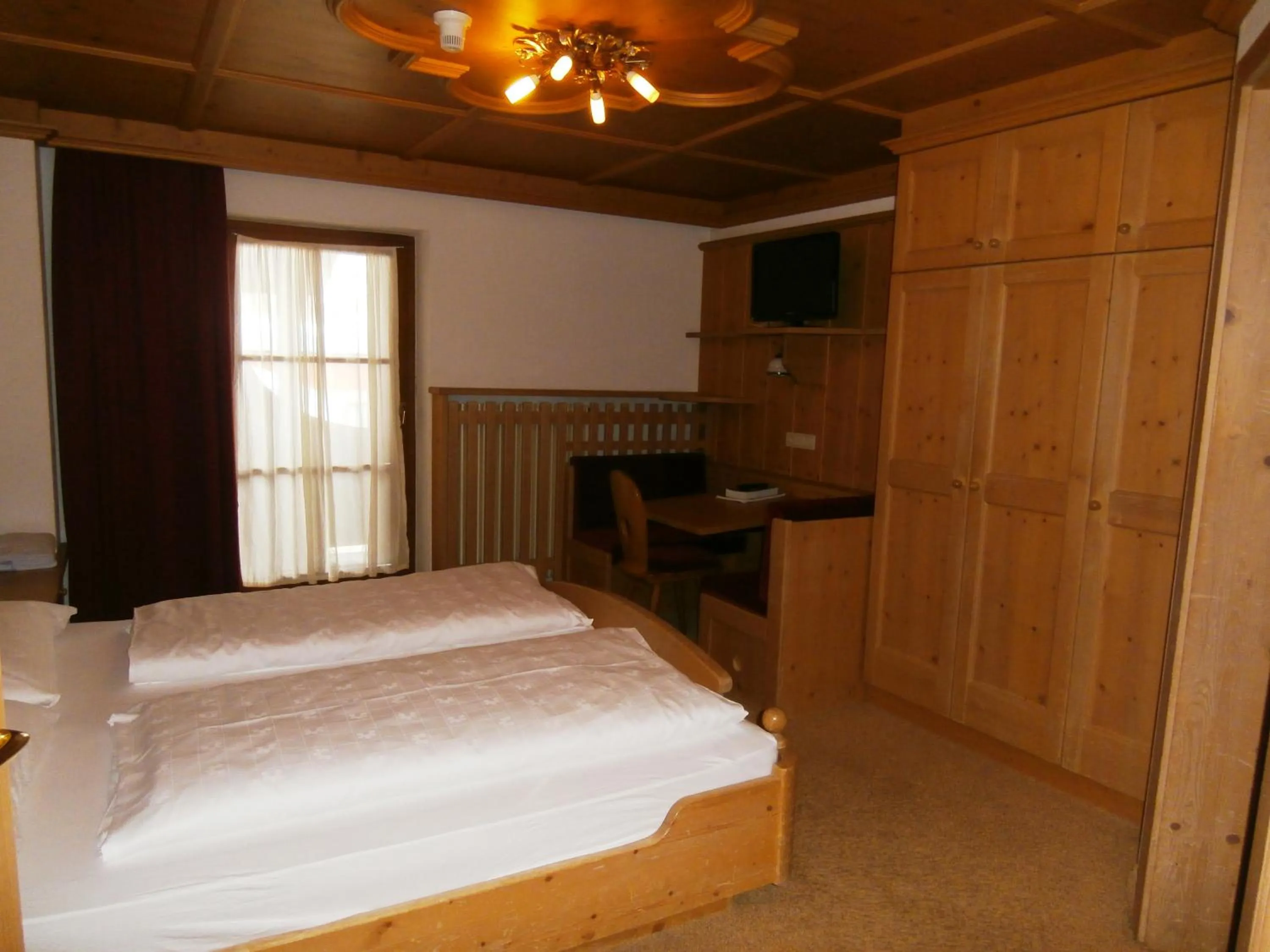 Bed in Piccolo Hotel Gurschler