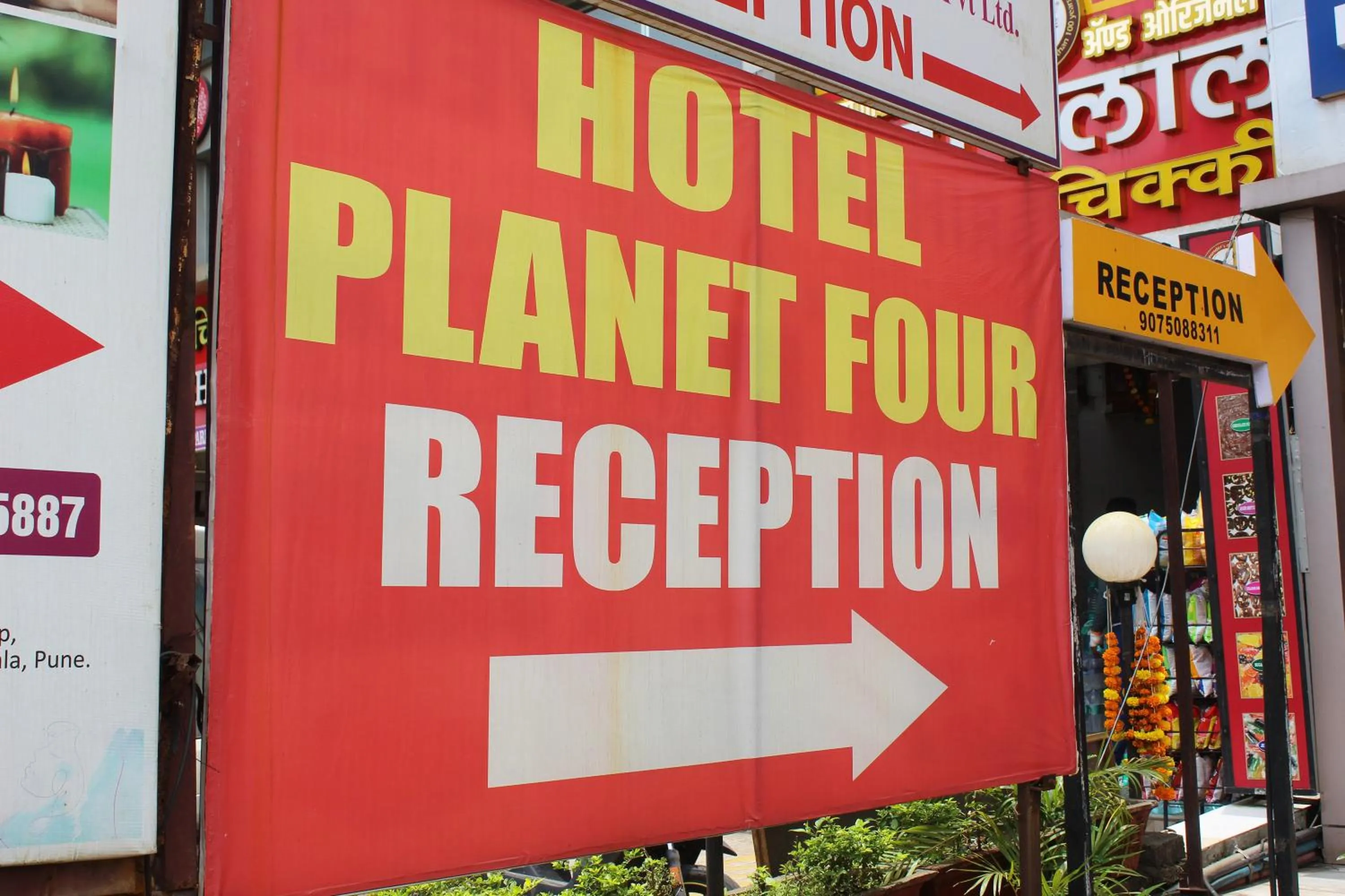 Property logo or sign in Hotel Planet Four