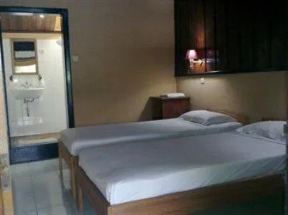 Bedroom in Ue Datu Cottages
