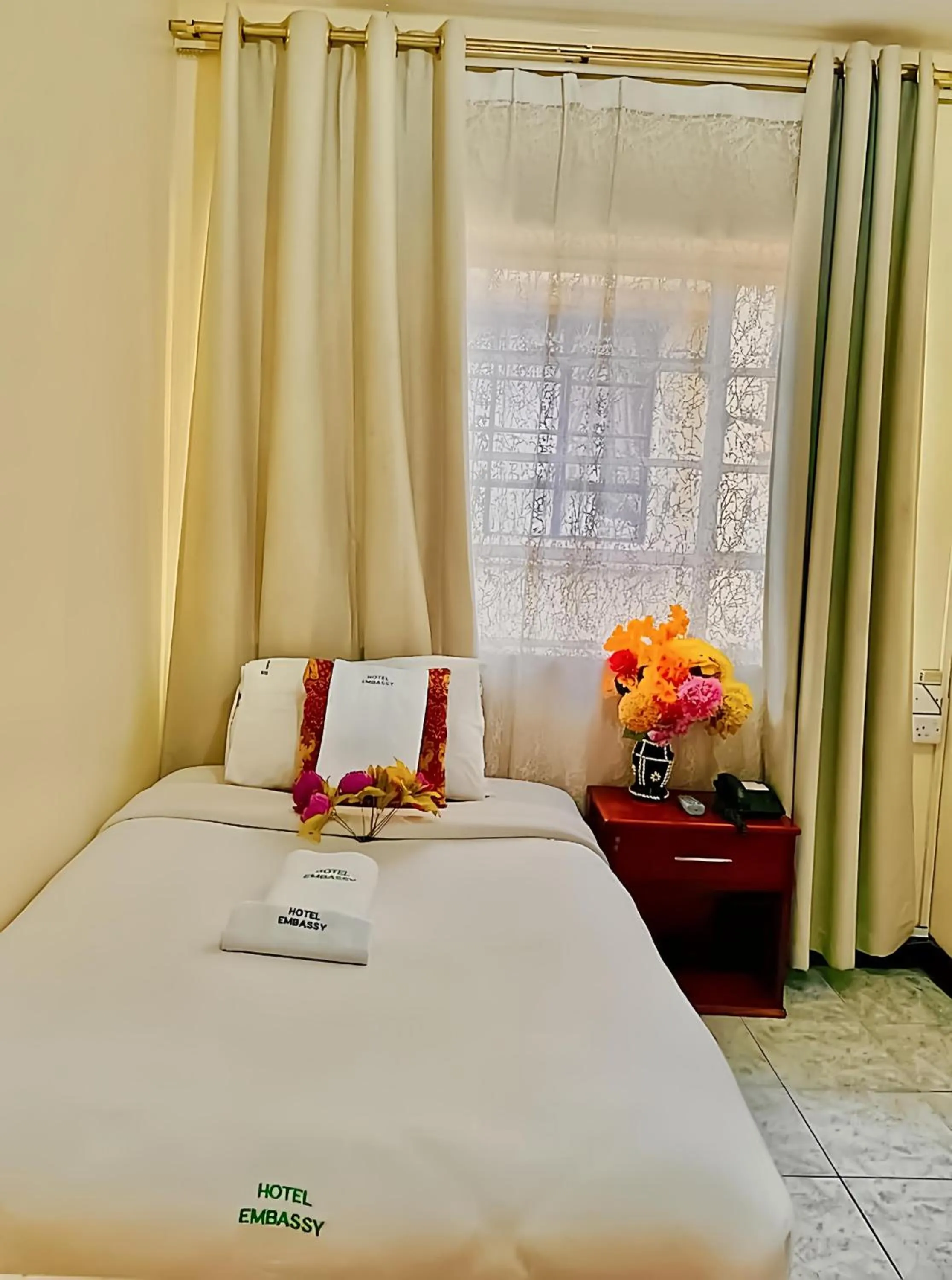 Bed in Hotel Embassy