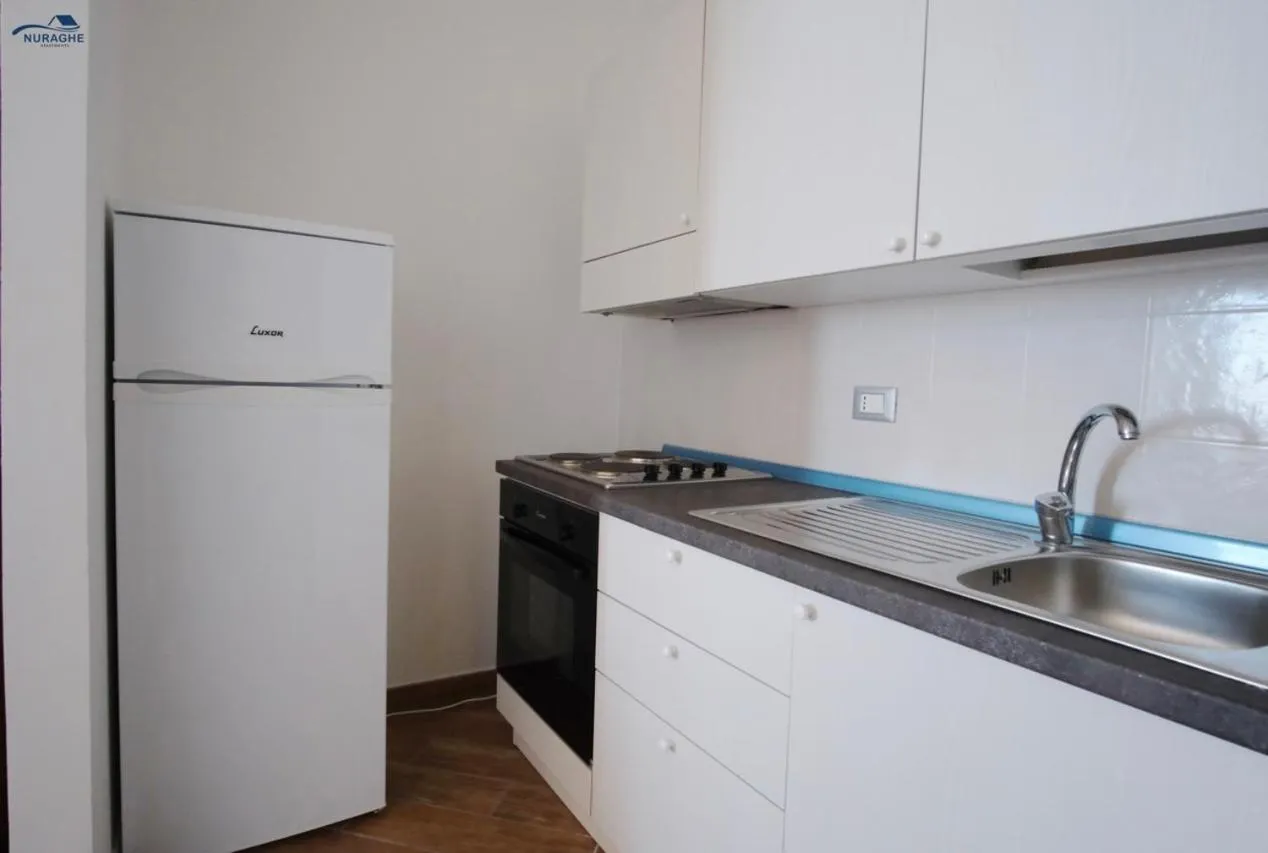 kitchen in Nuraghe Apartments