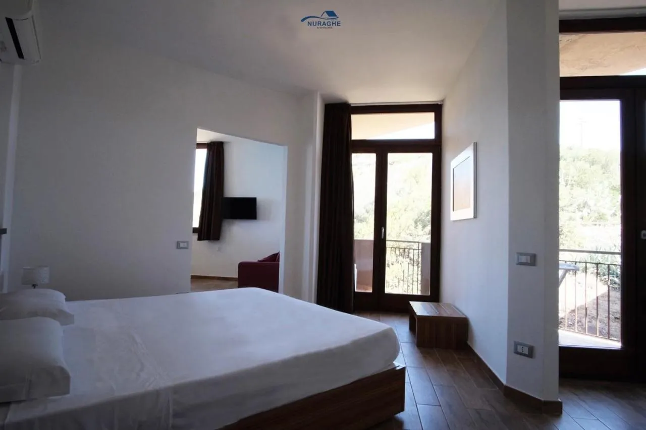 Bed in Nuraghe Apartments