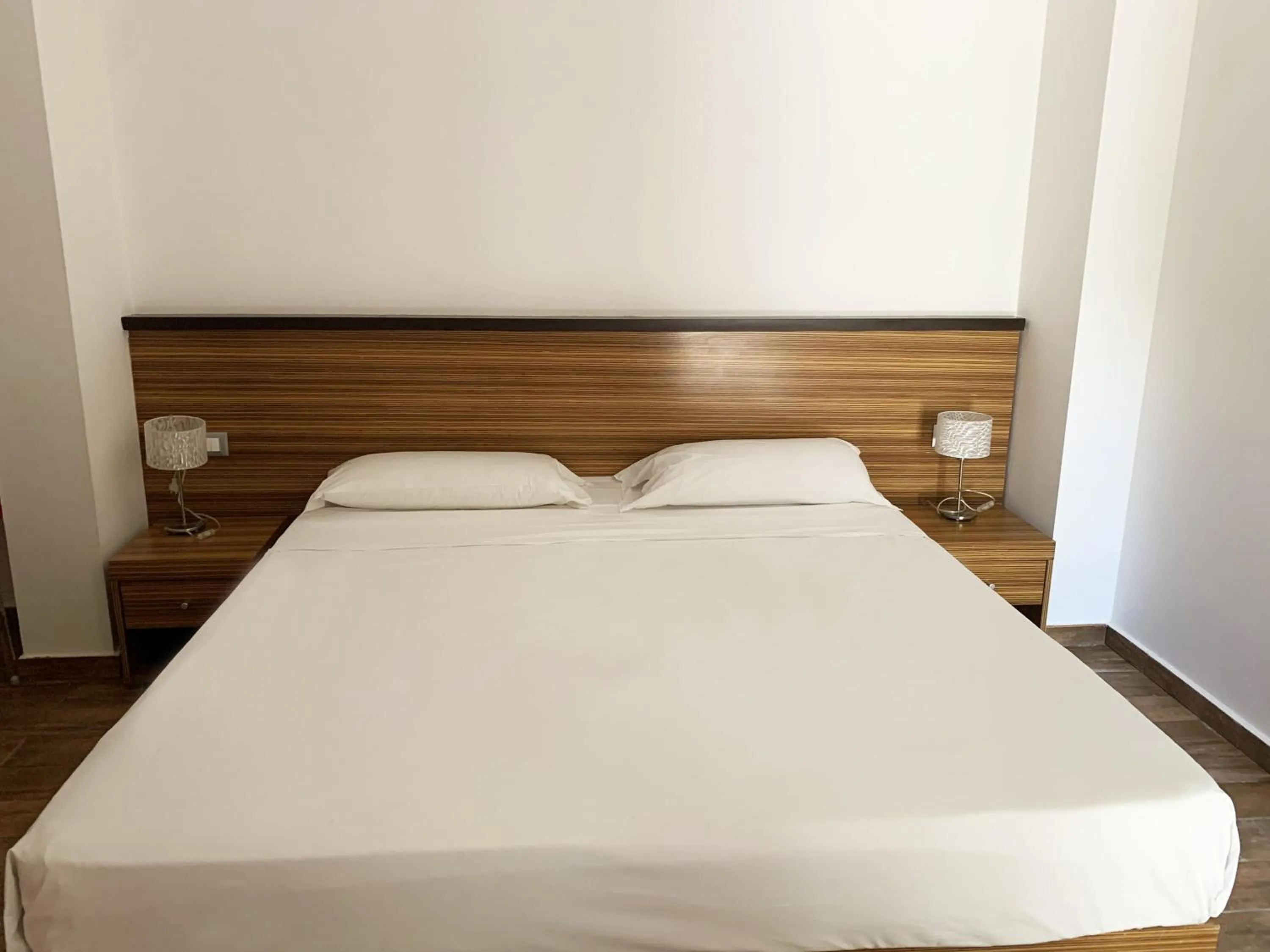 Bed in Nuraghe Apartments