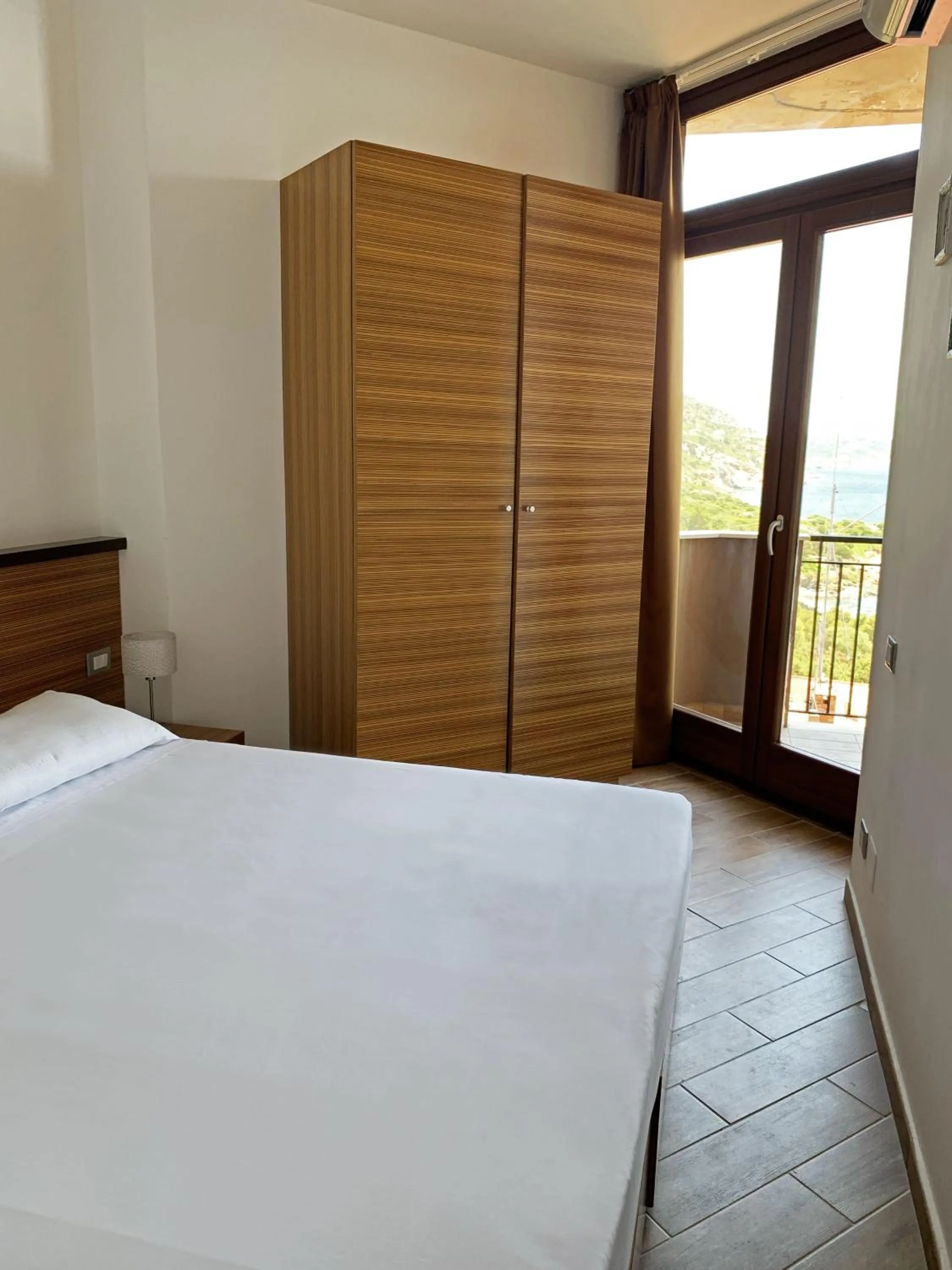 Bed in Nuraghe Apartments