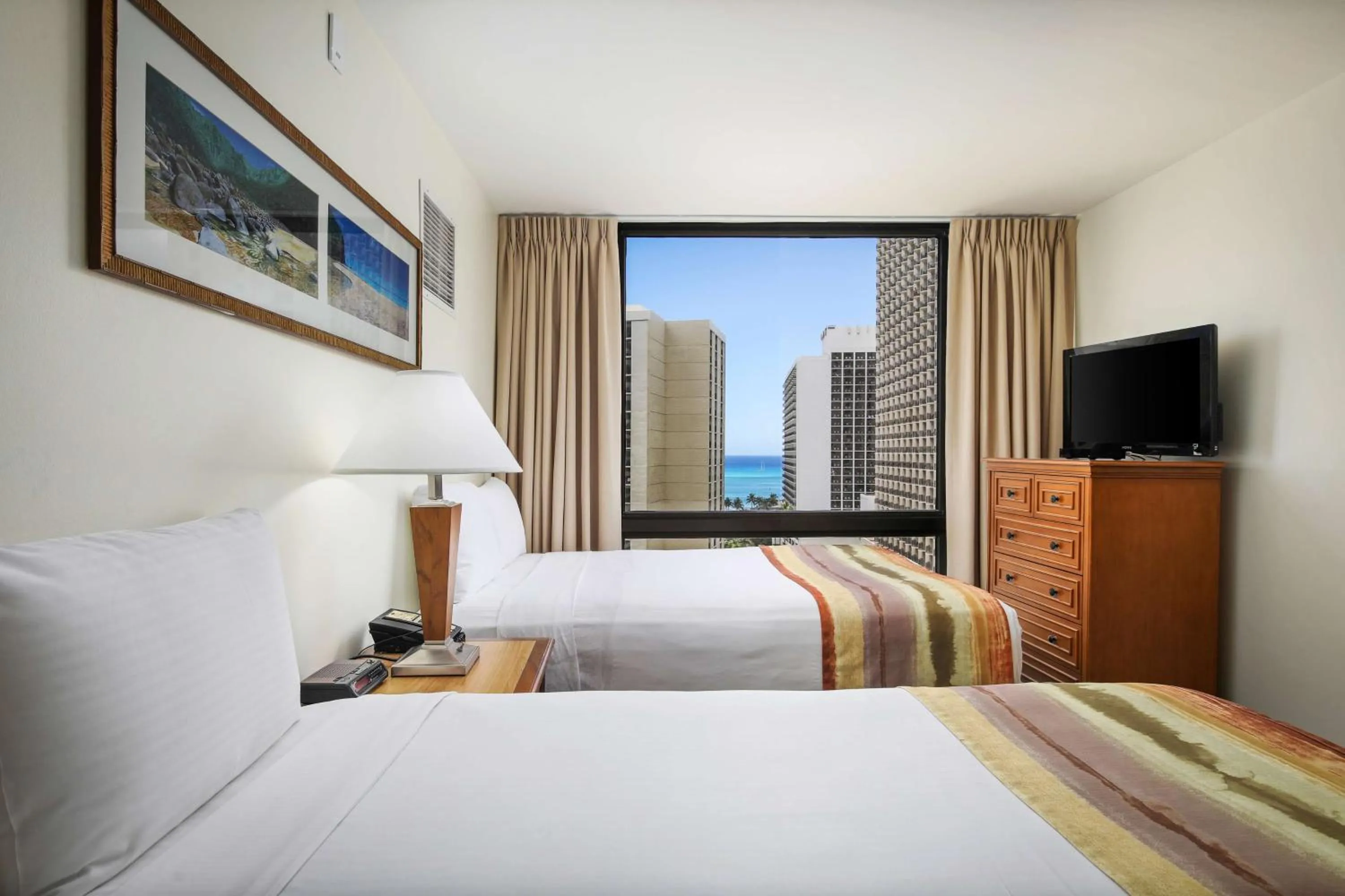 Bed in Aston Waikiki Sunset