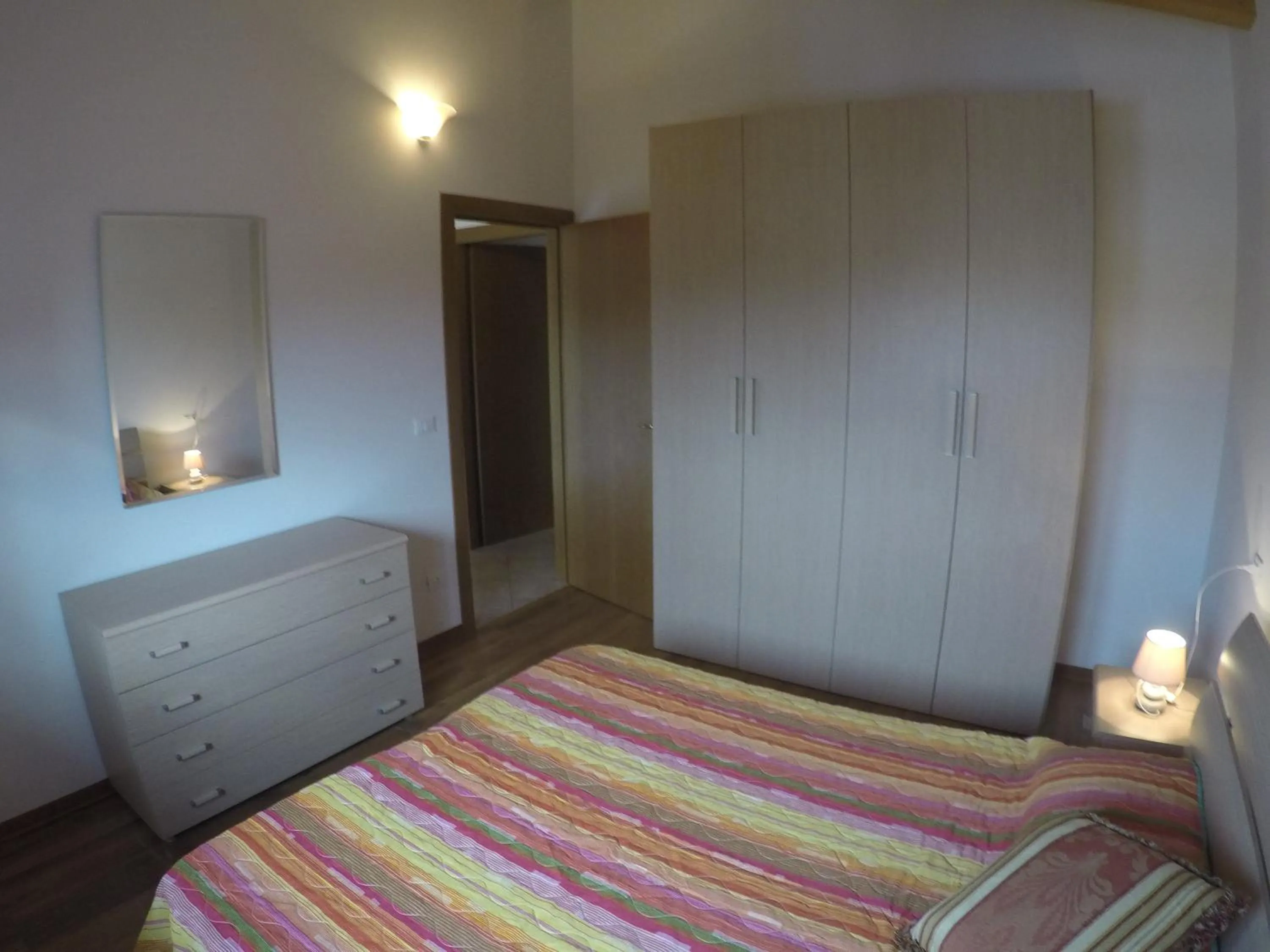 Bedroom in Residence Caorle Apartments - Agenzia Cocal