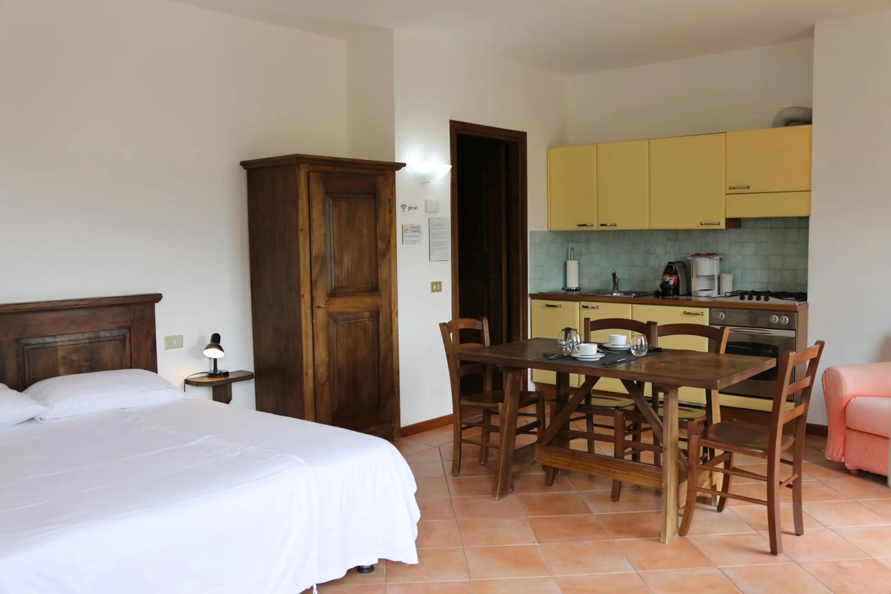 Kitchen or kitchenette, Bed in Appartamenti Ferrari Residence