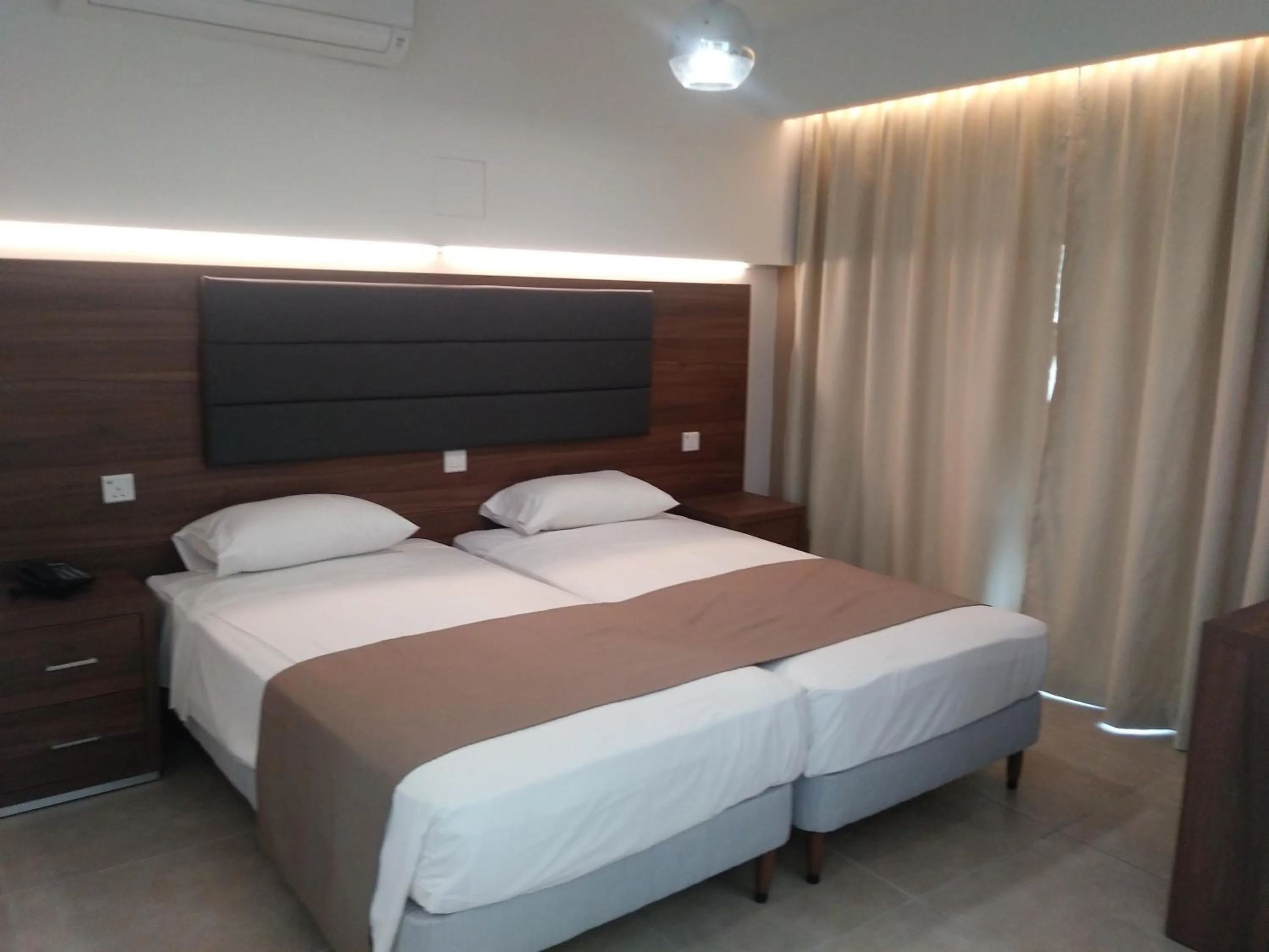 Bed in Livas Hotel Apartments