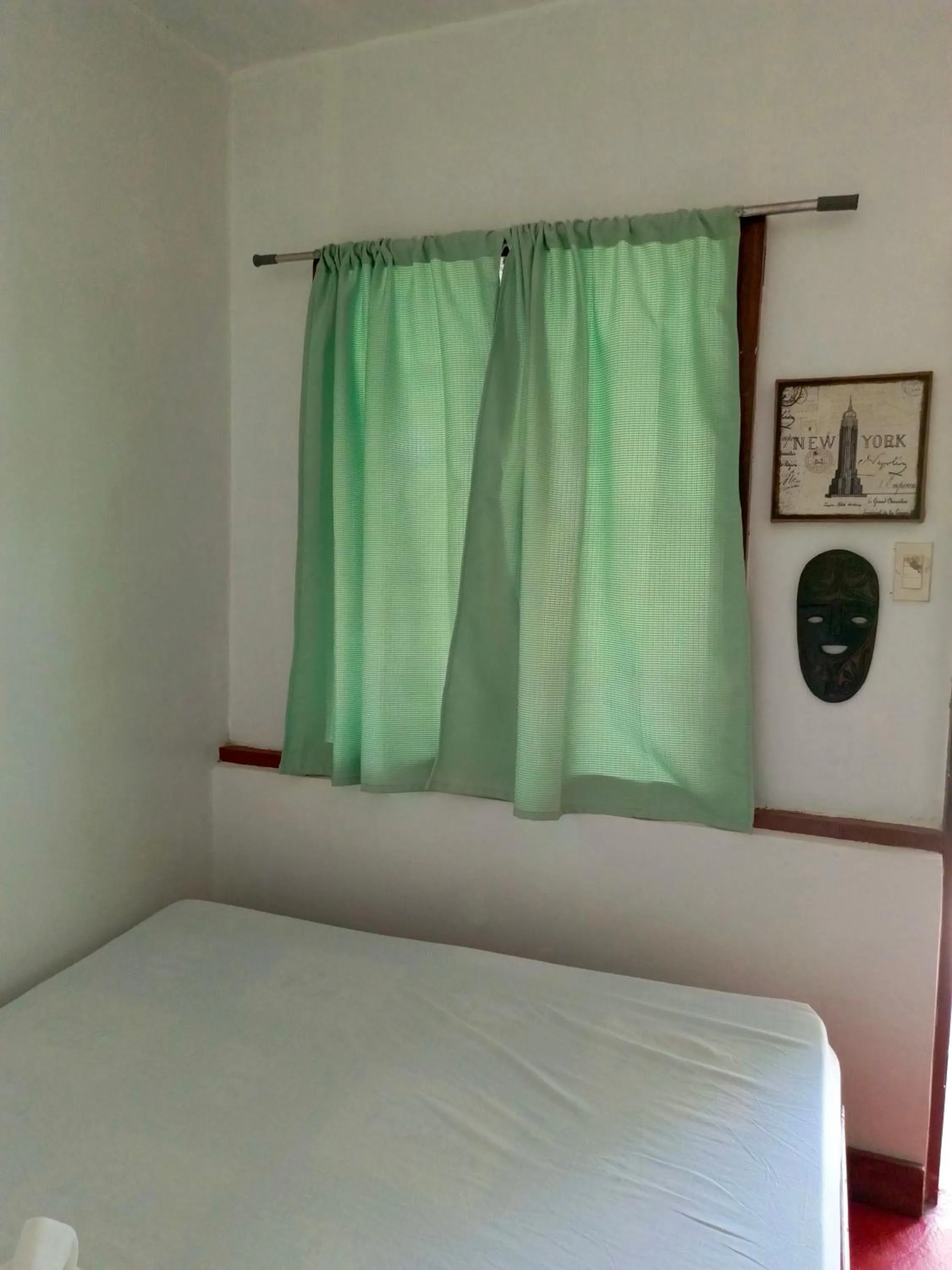 Bed in MiL's Hillside Tourist Inn