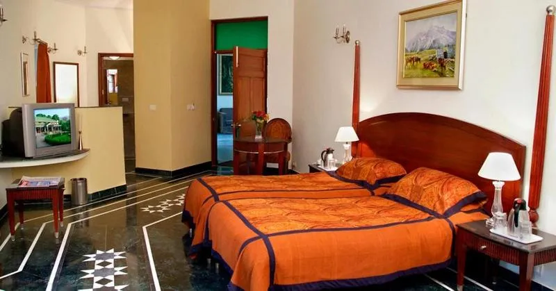 Bed in WelcomHeritage Taragarh Palace