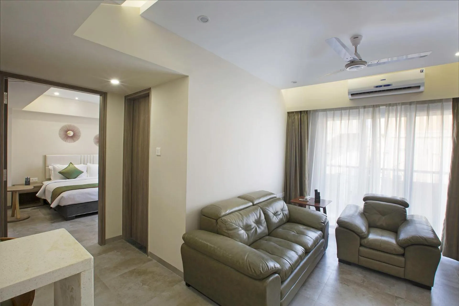 Living room, Bed in Floressa Randa Business Hotel