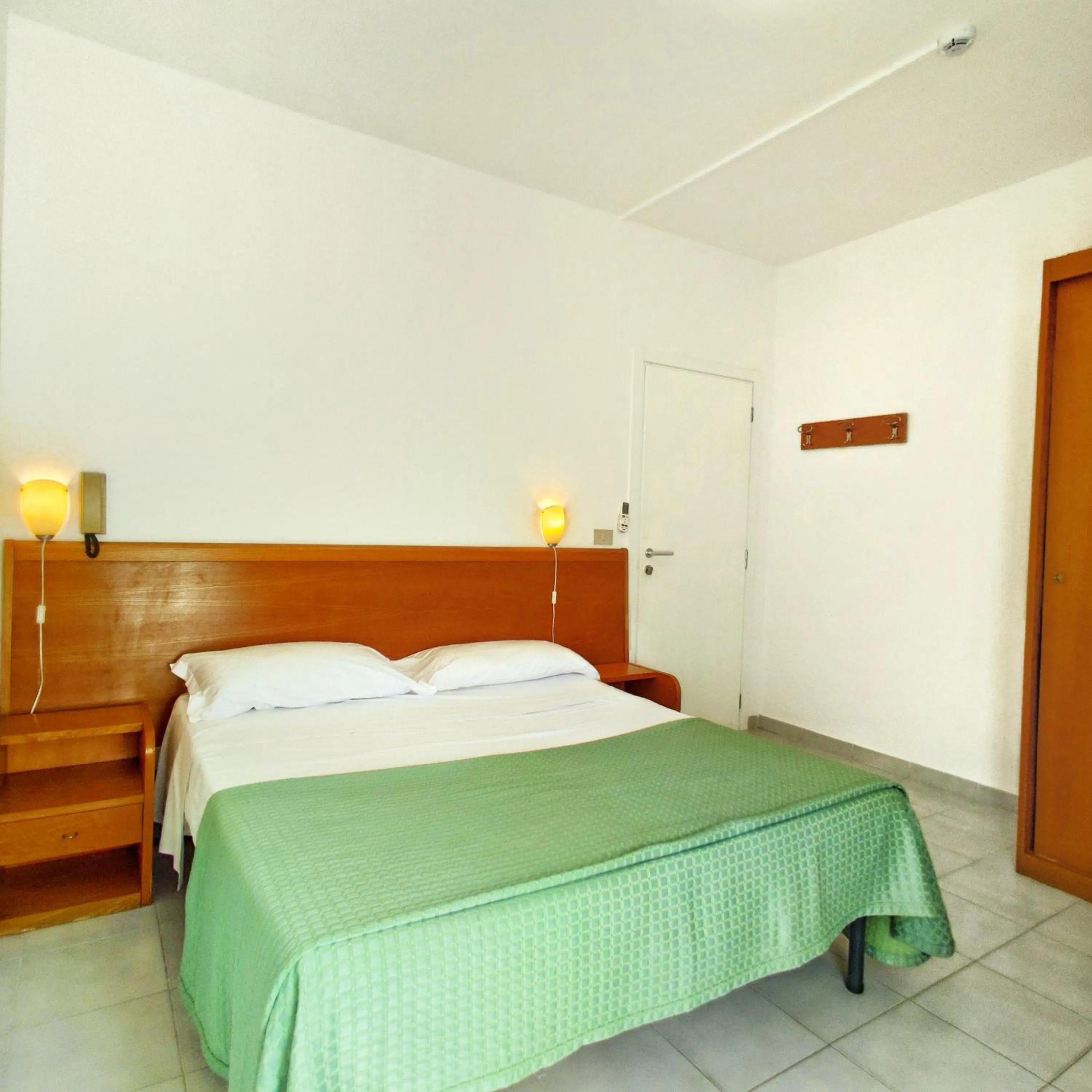 Bed in Piccolo Hotel