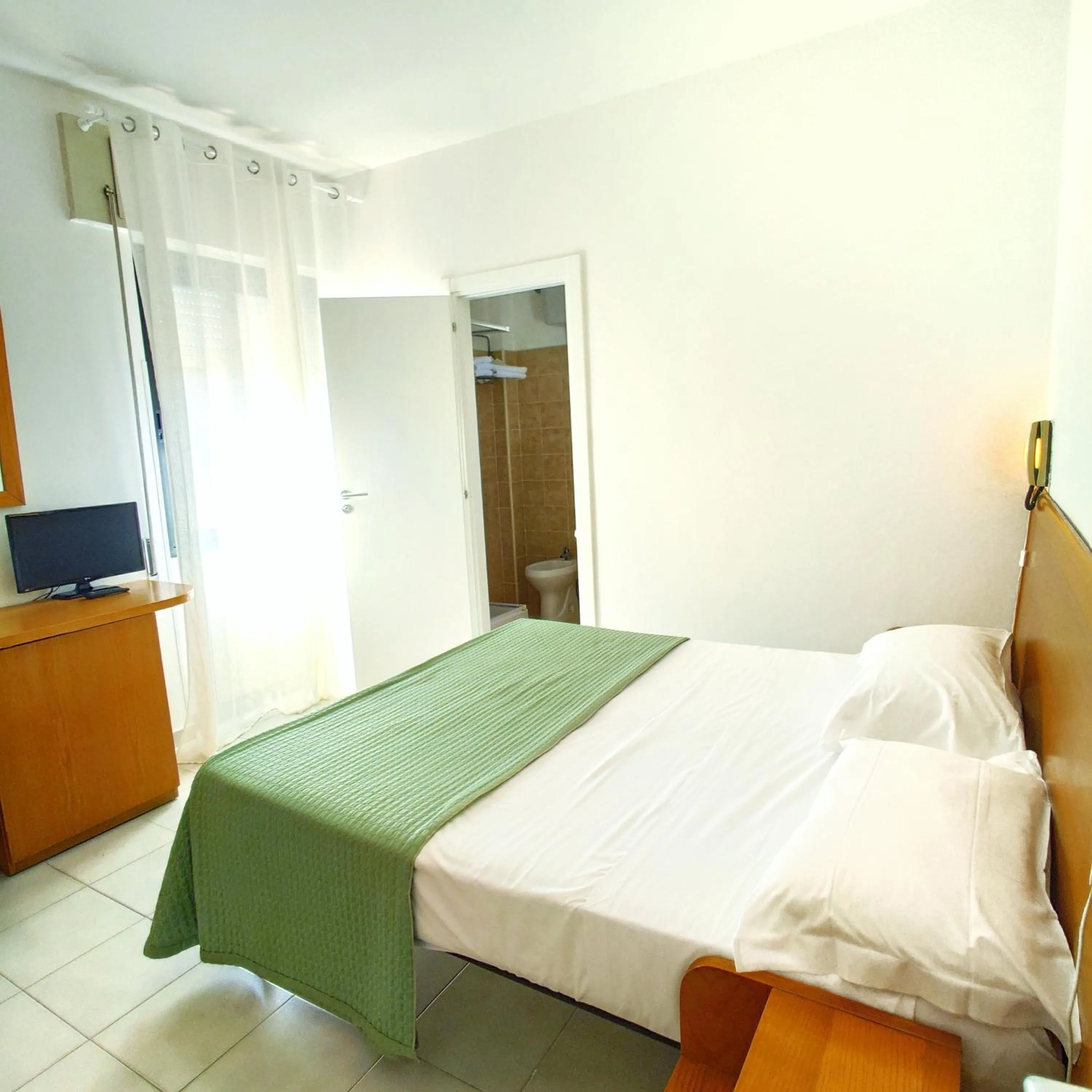 Bed in Piccolo Hotel