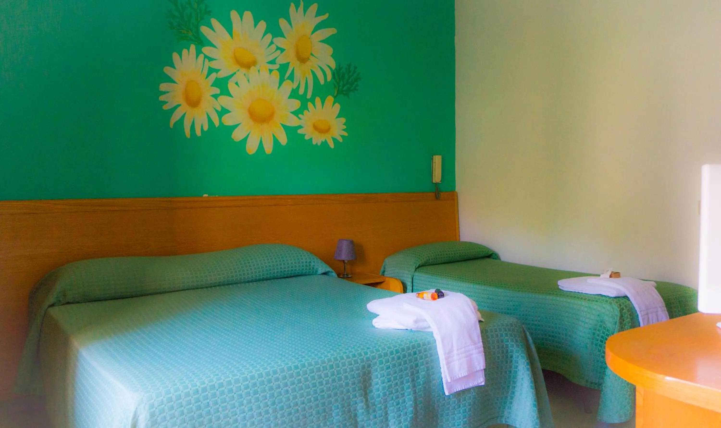 Bed in Piccolo Hotel