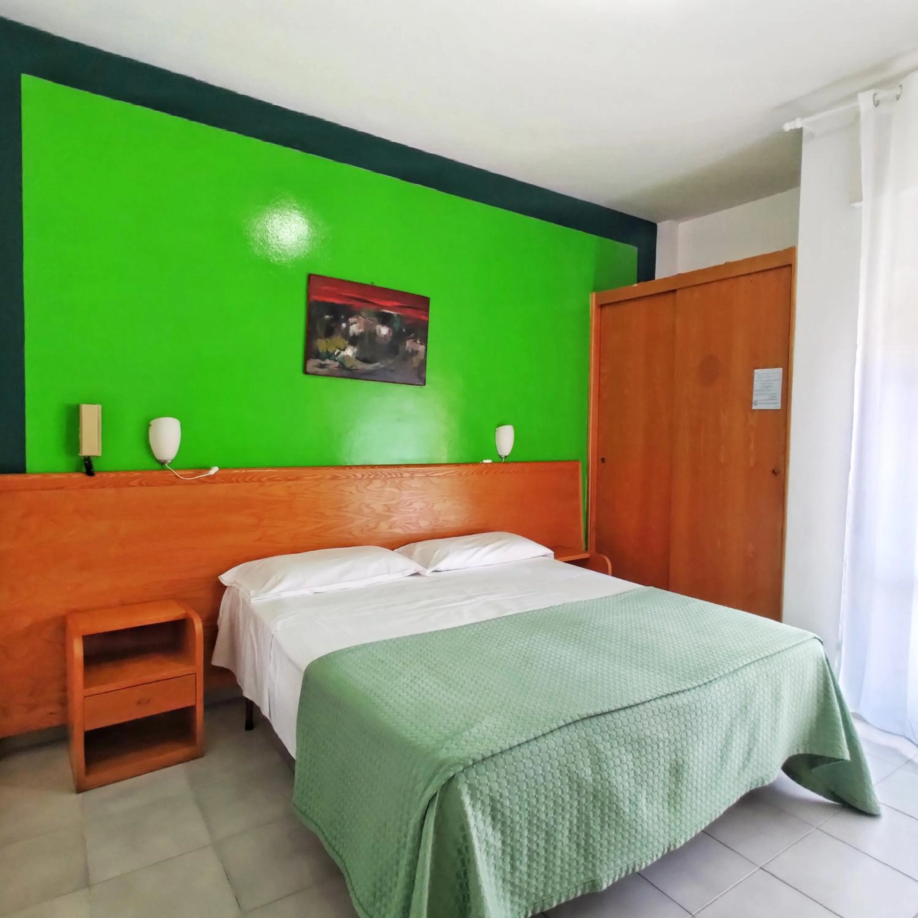 Bed in Piccolo Hotel